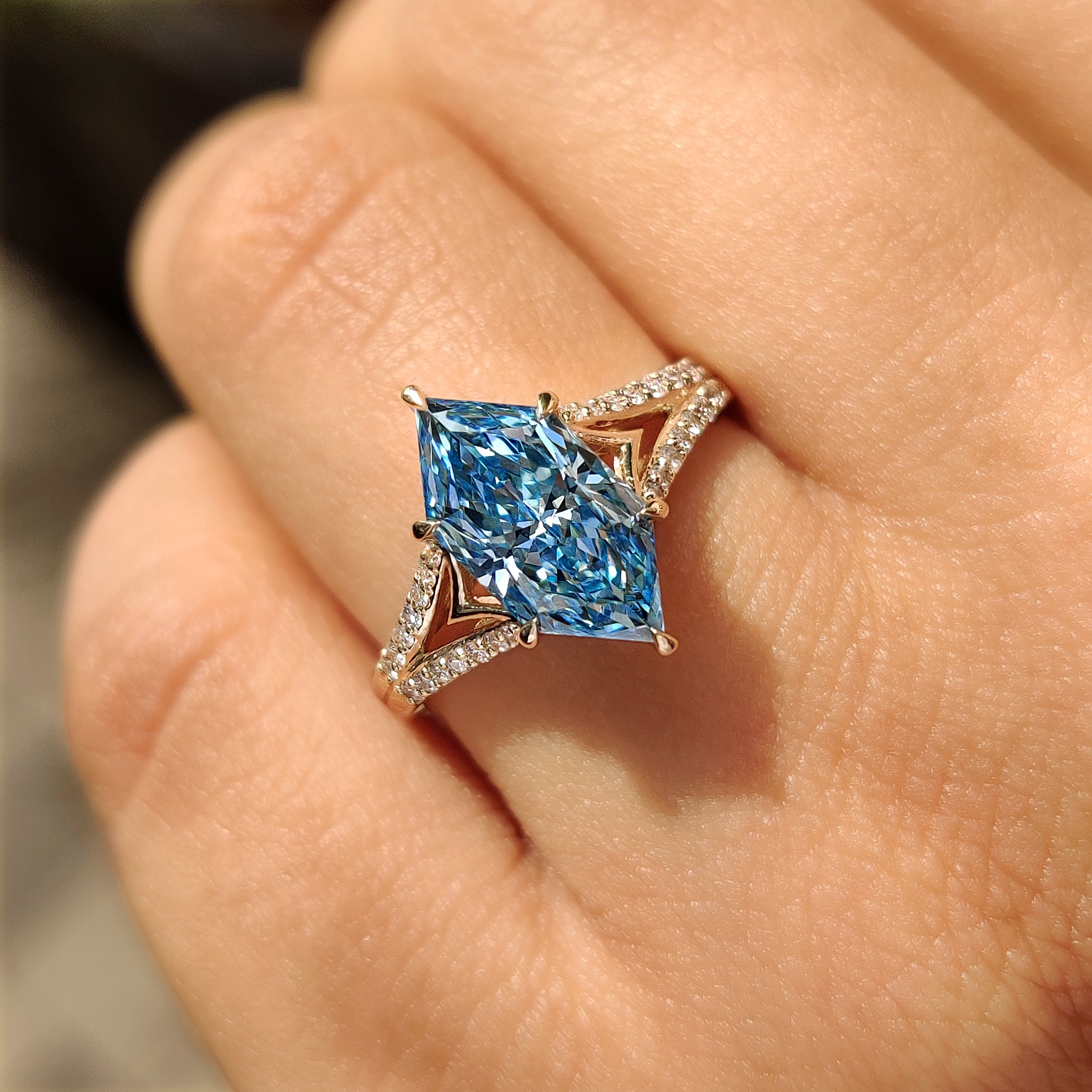 Marquise diamond ring with pave style round side stones
