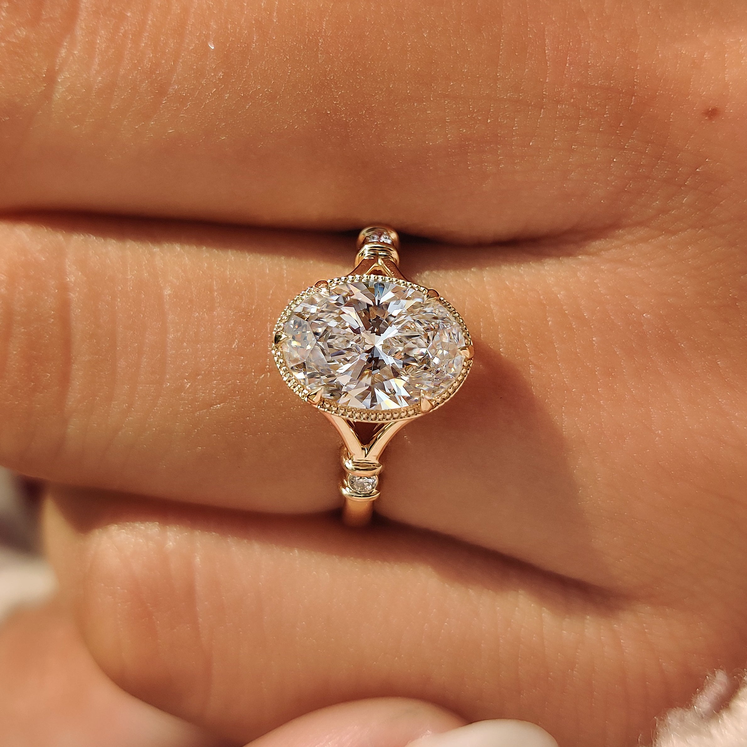 Handmade yellow gold oval engagement ring by Carat Diamonds.
