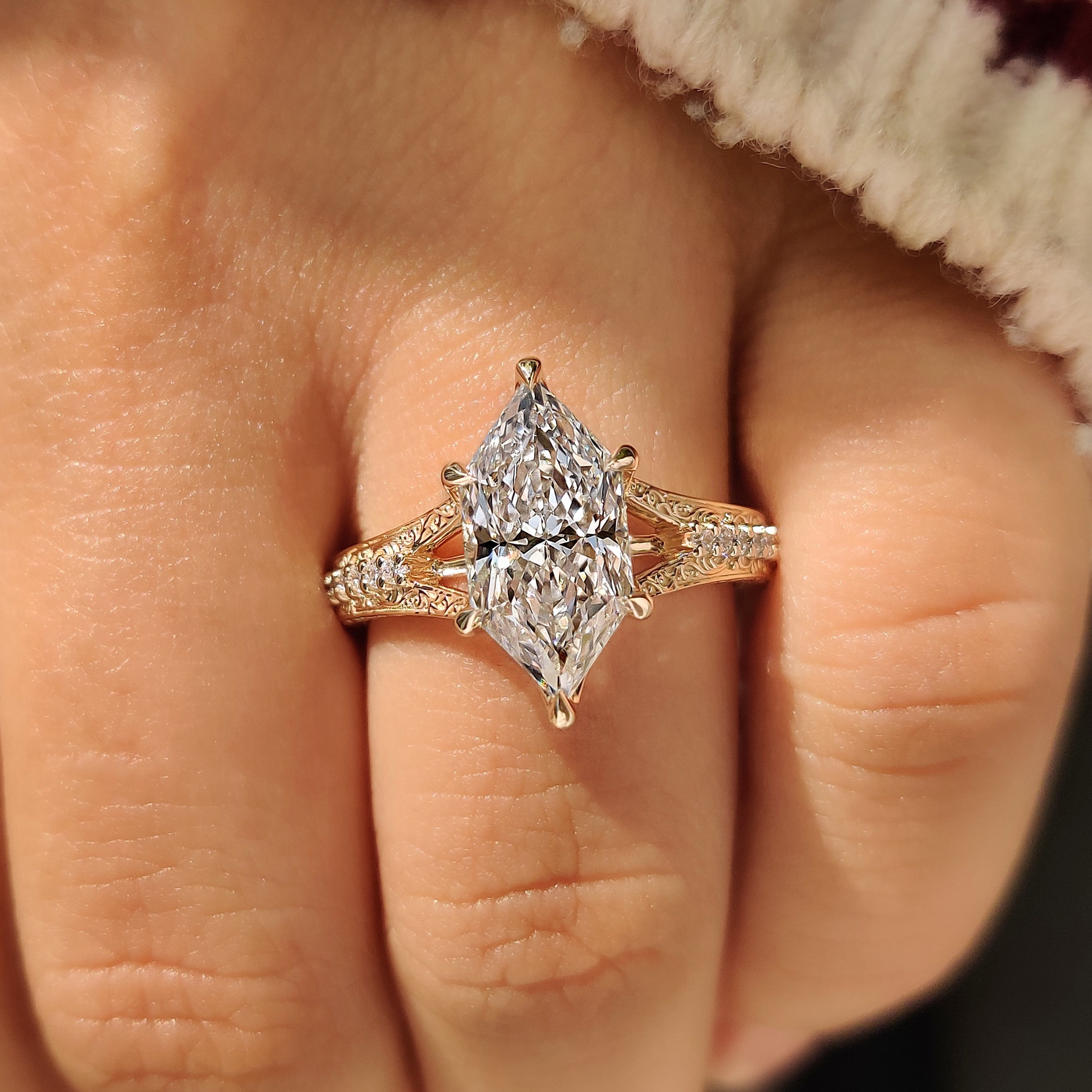 Marquise diamond engagement ring with pave round diamond
