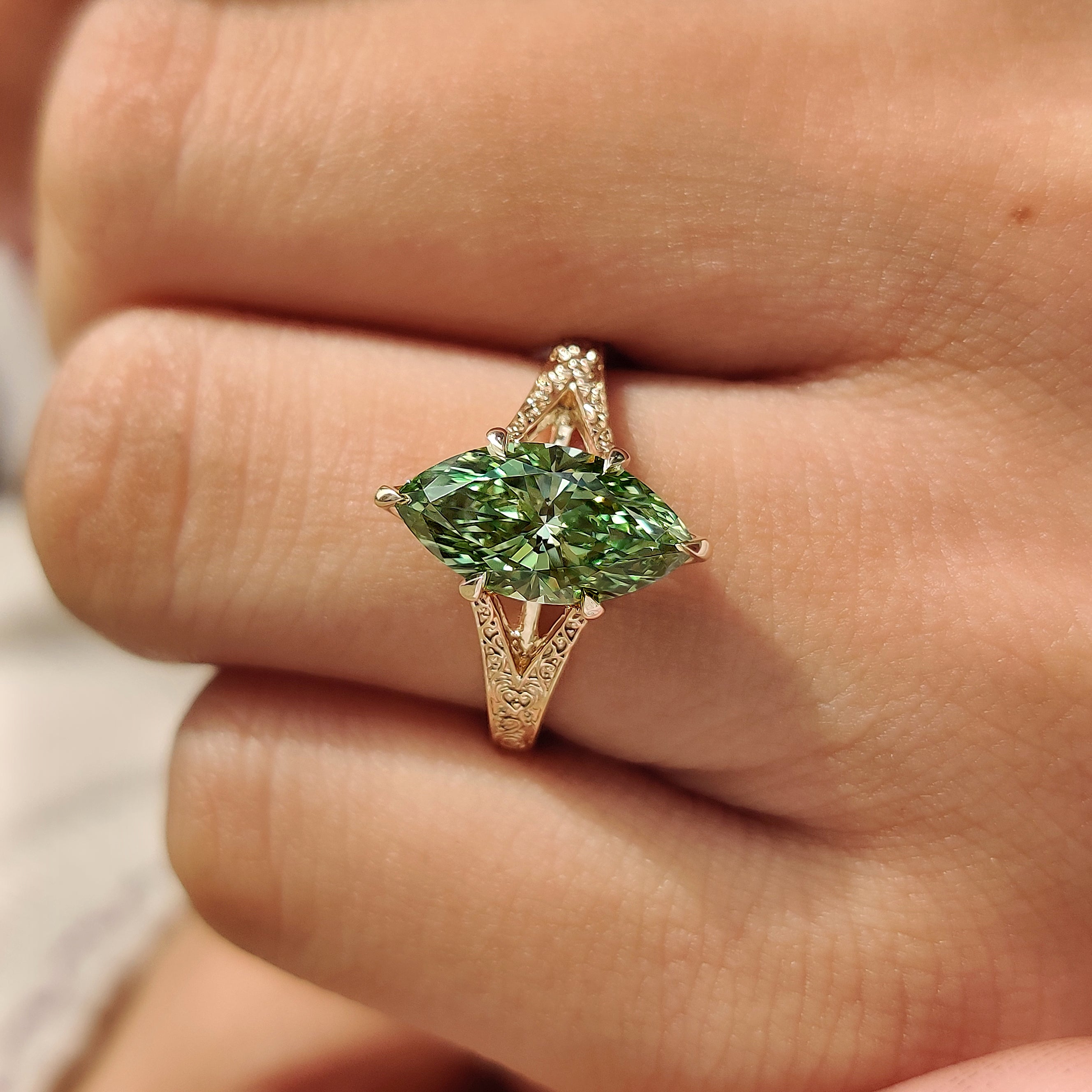 Vintage inspired solitaire ring with green marquise diamond