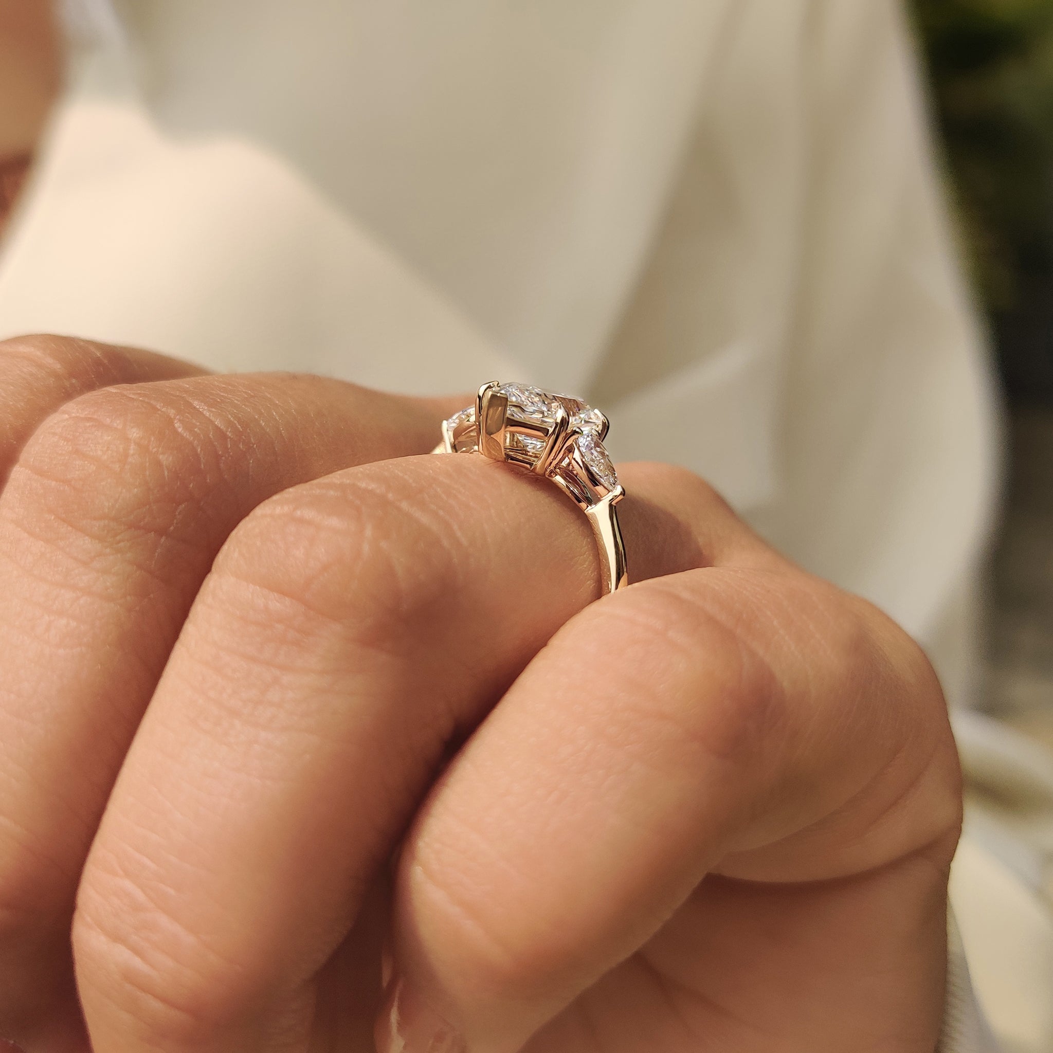 Carat Diamonds three stone engagement ring with pear sides
