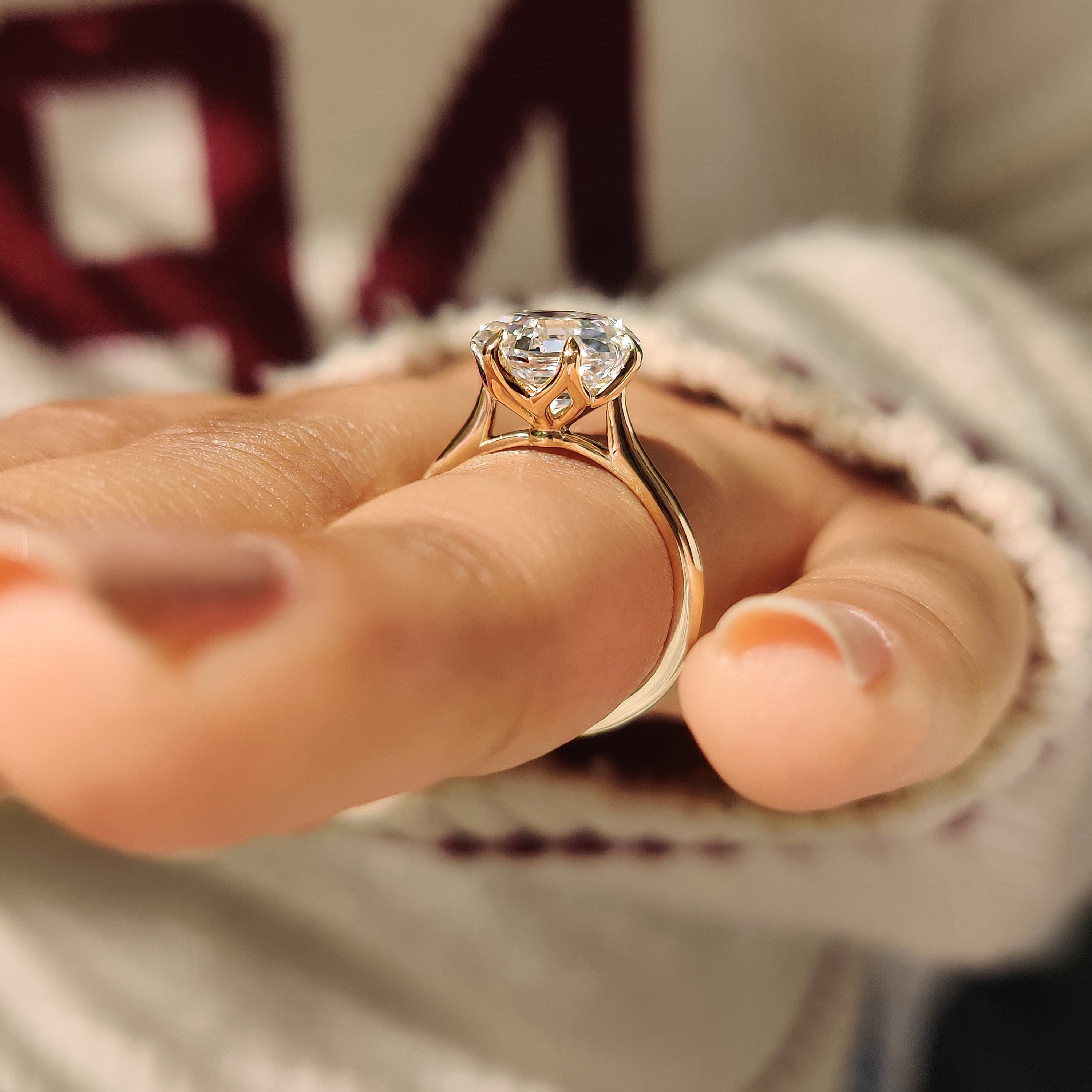 Solitaire lab grown diamond ring with six claw prongs

