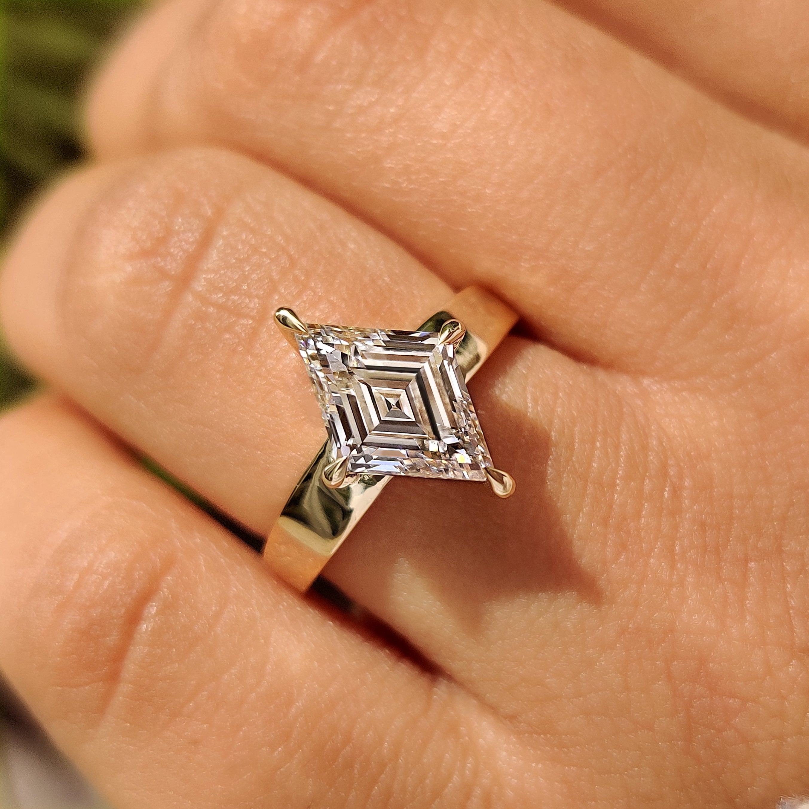 Handmade lozenge cut diamond ring with solitaire style setting
