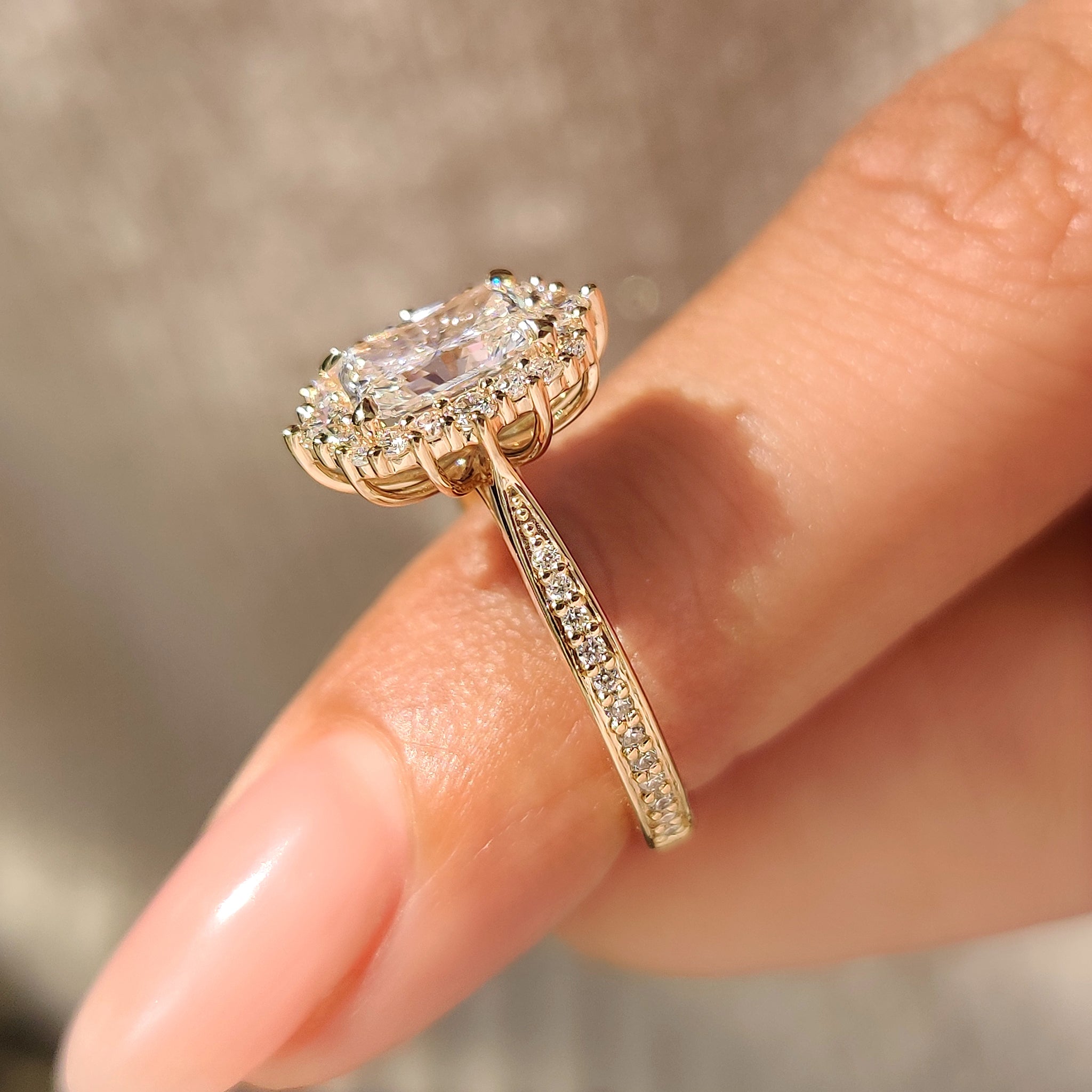 Vintage radiant ring with round halo and pave band.
