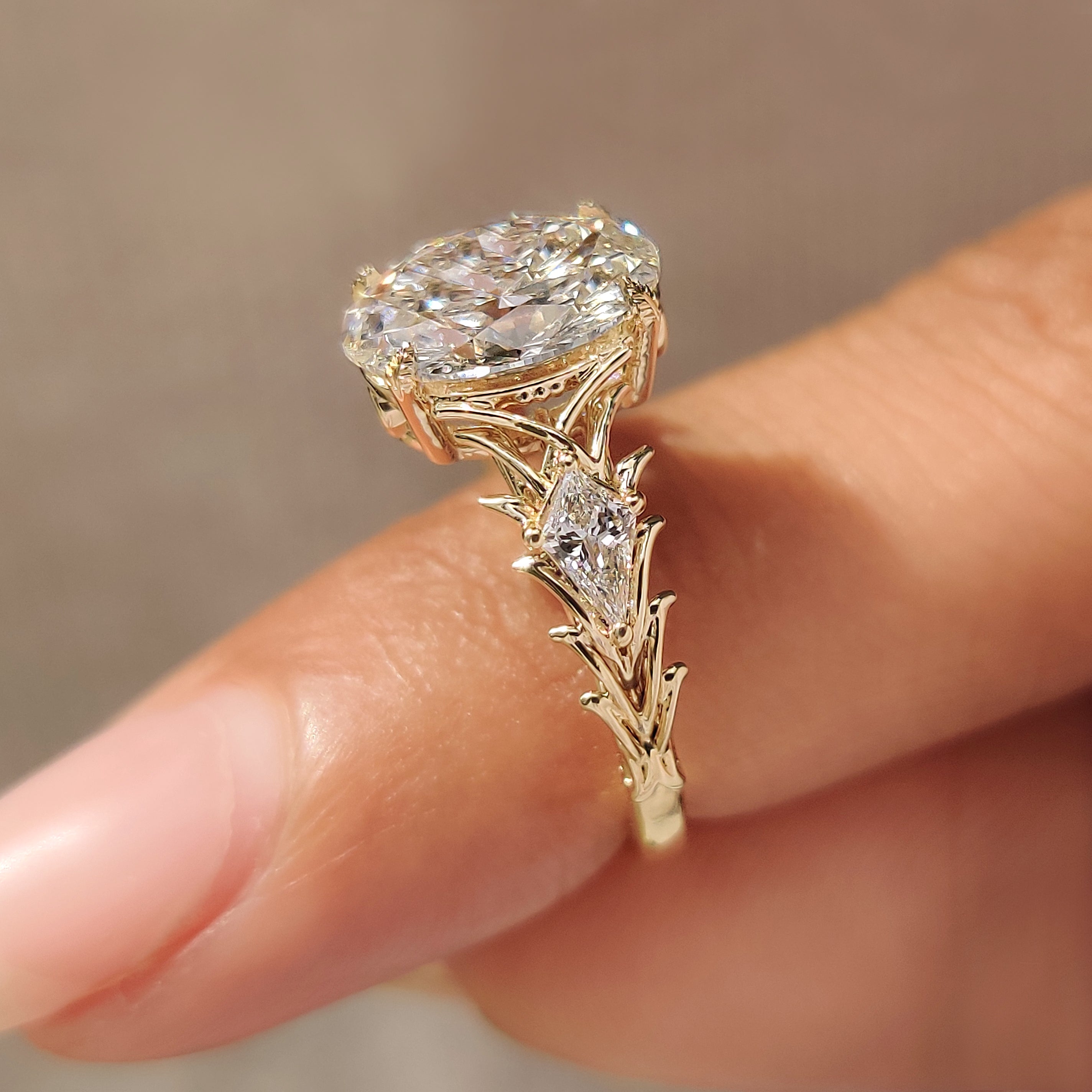 Oval diamond ring with thorn style setting
