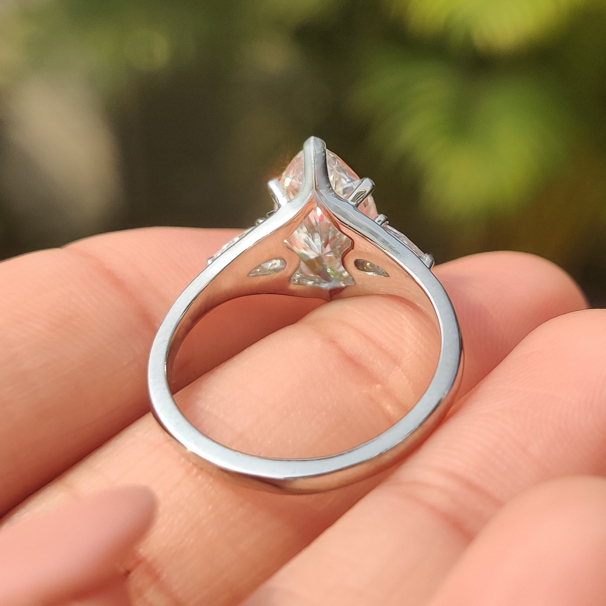 Carat Diamonds marquise diamond ring with pear side stone
