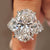 Oval diamond ring with trillion side stones
