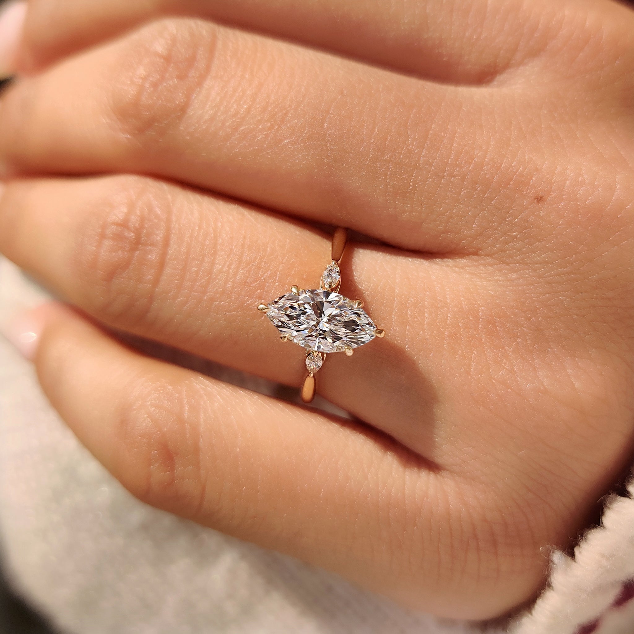 Three stone marquise ring with lab grown diamond.
