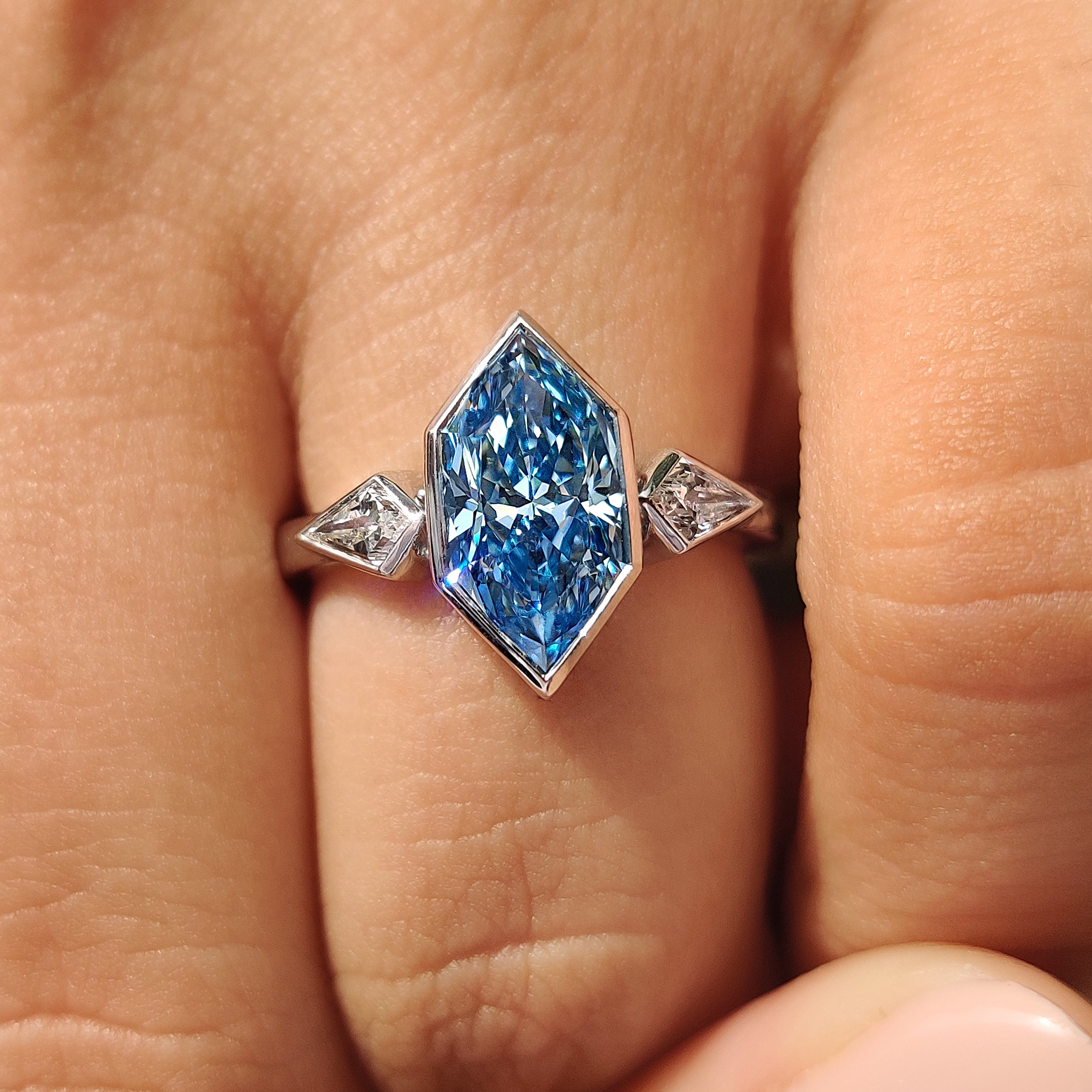 Handmade three stone engagement ring with bezel setting
