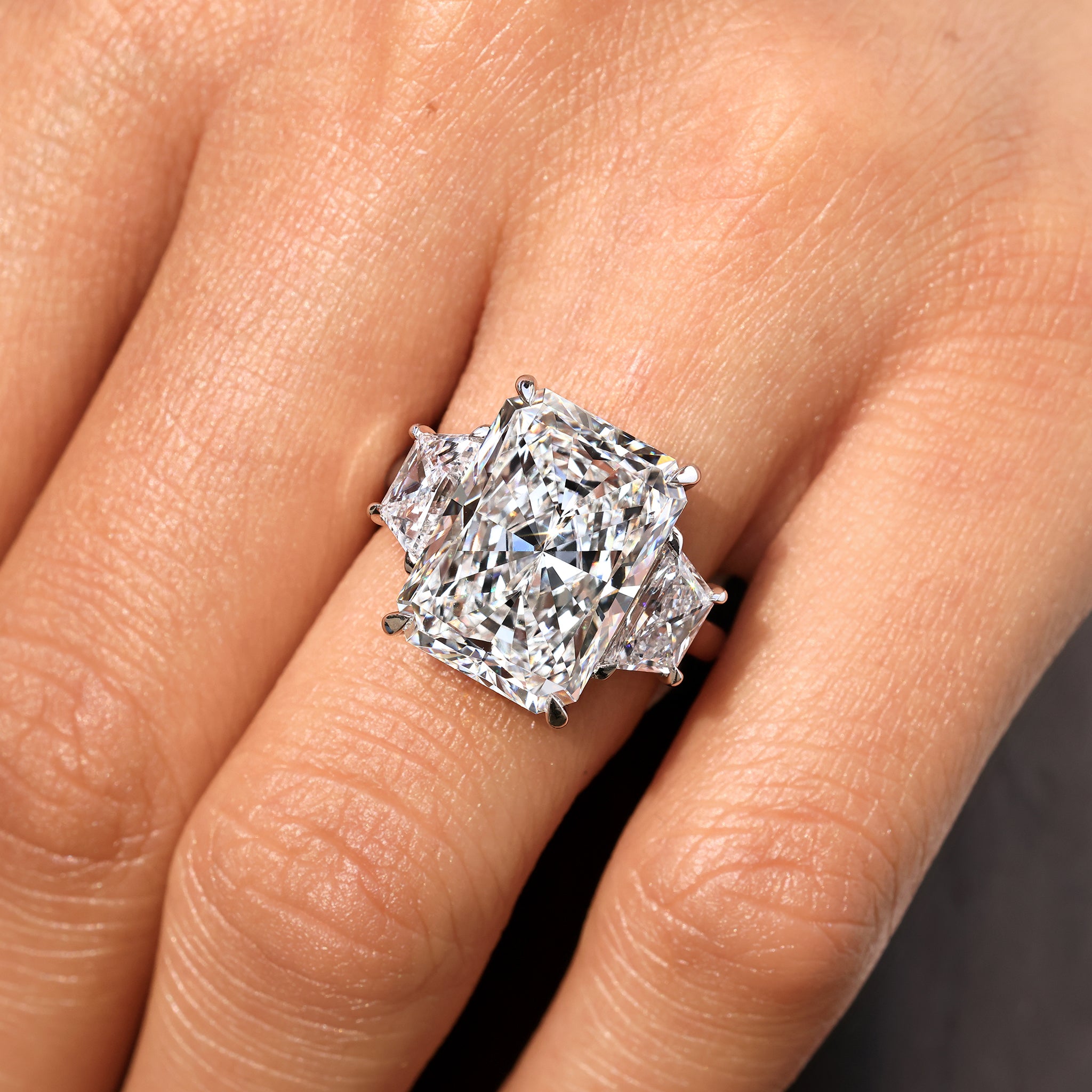 Carat Diamonds radiant cut diamond ring with cathedral style.
