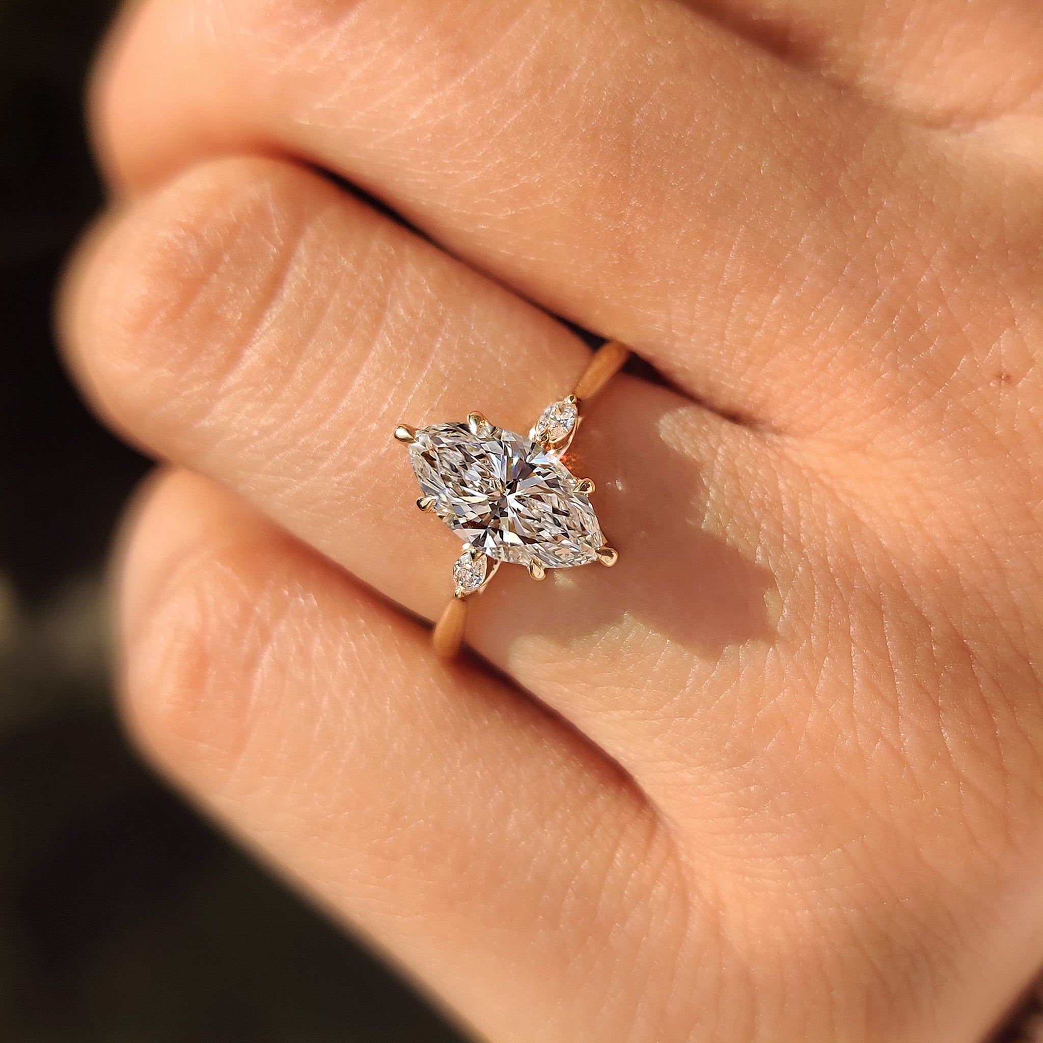 Handmade marquise diamond ring with tulip setting design.
