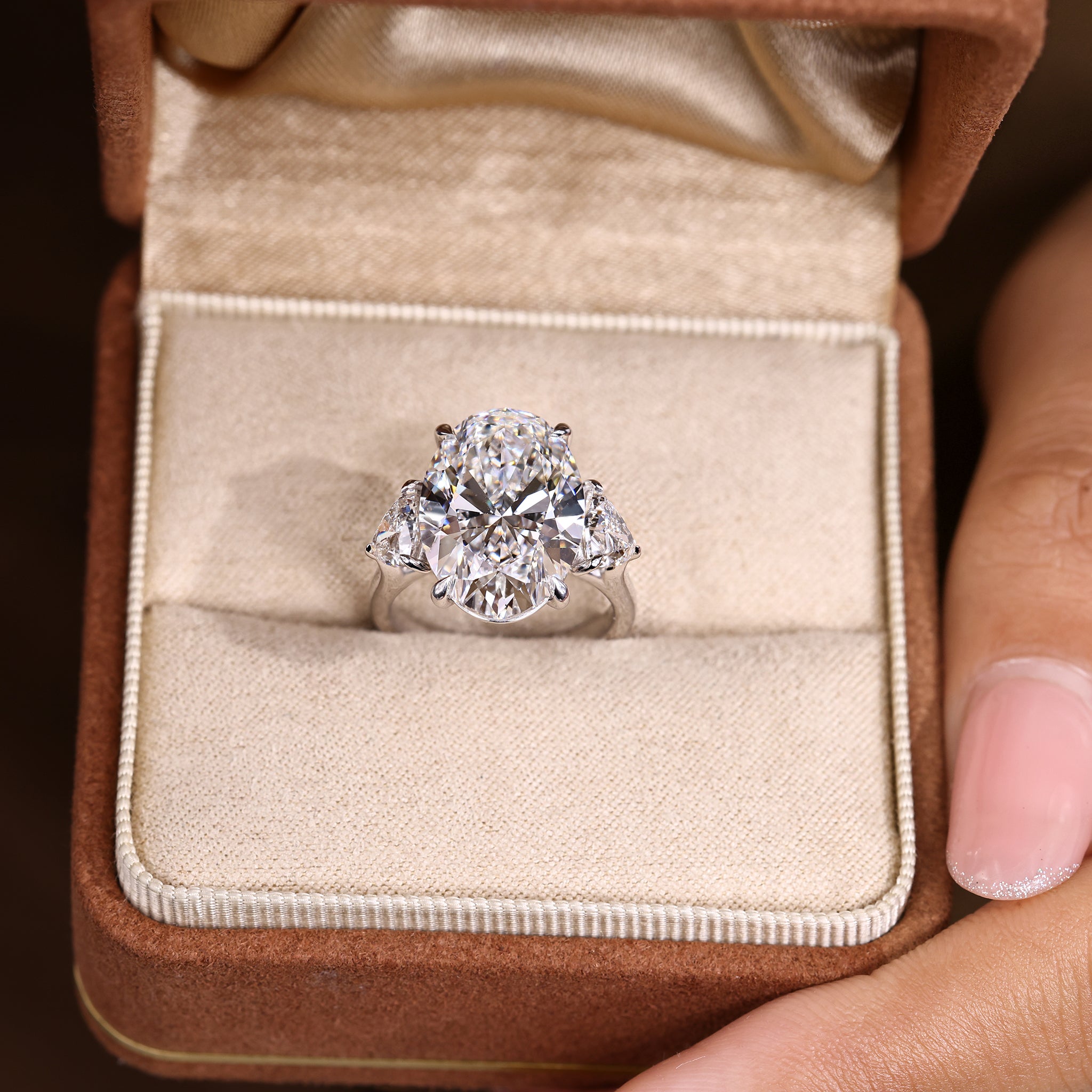 IGI Certified 10 -15 Carat Oval Diamond Ring in Three Stone Style