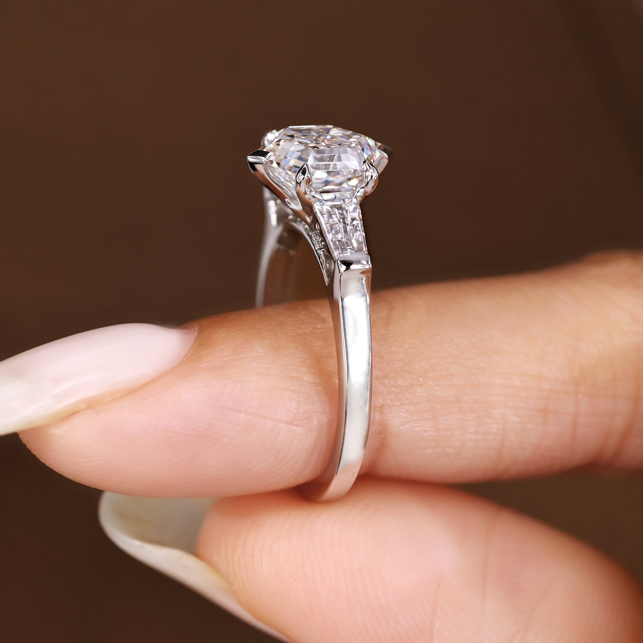 Three diamond engagement ring with four prong setting design.
