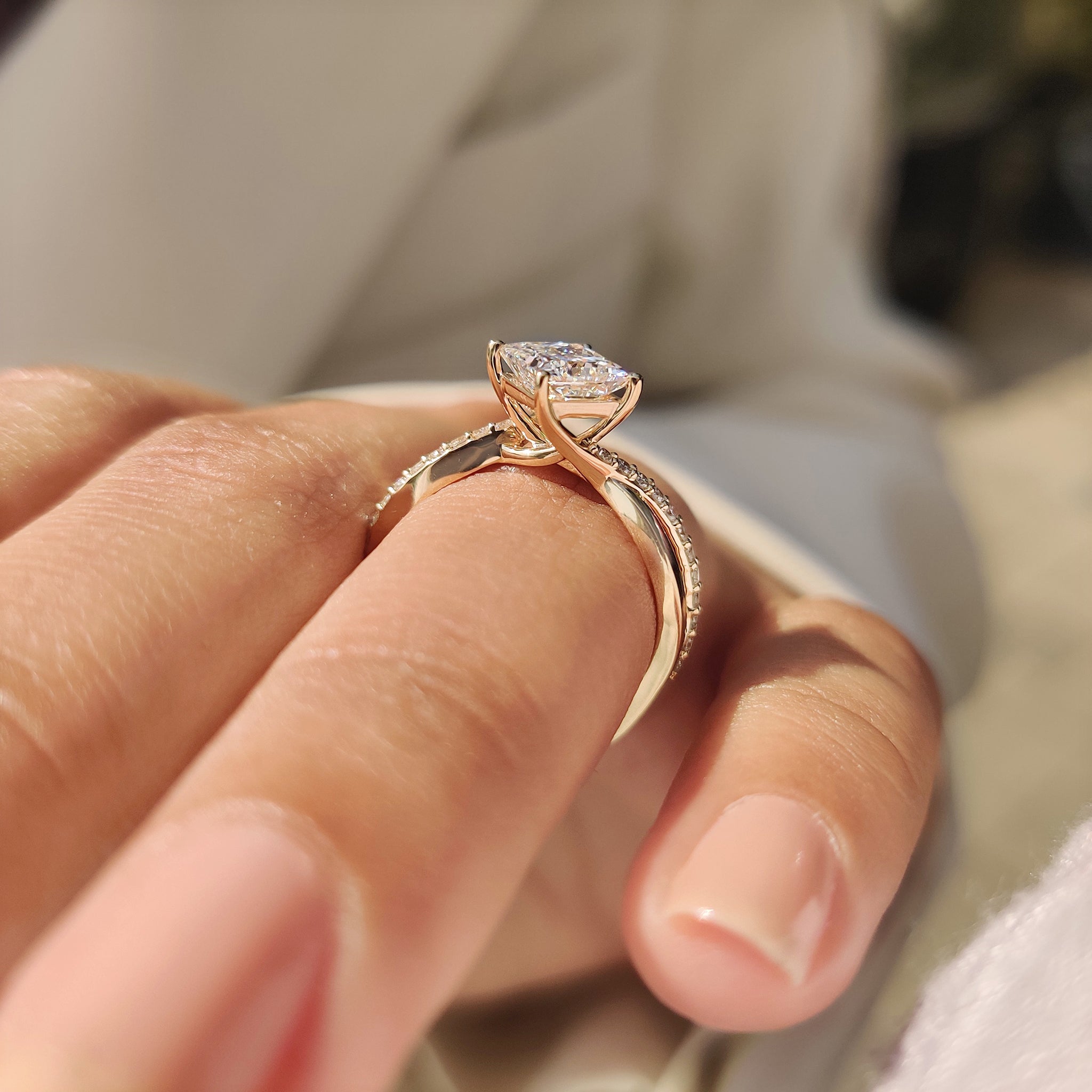 Princess cut diamond ring with round diamond pave band
