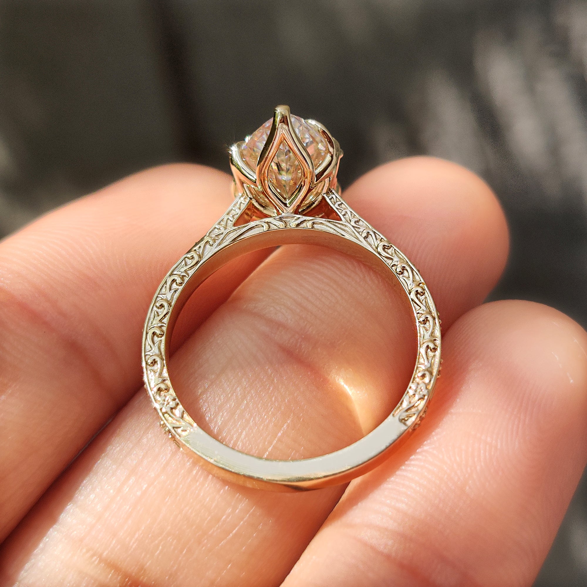 Tulip setting marquise diamond ring with leaf details.
