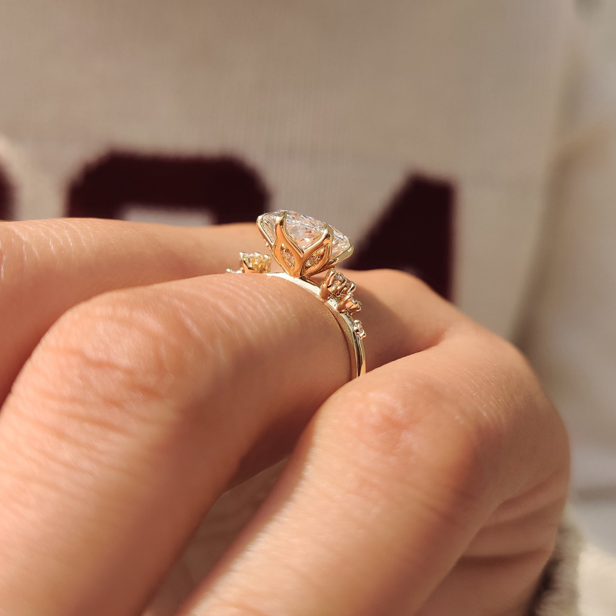 Oval cut lab grown diamond ring with tulip setting.
