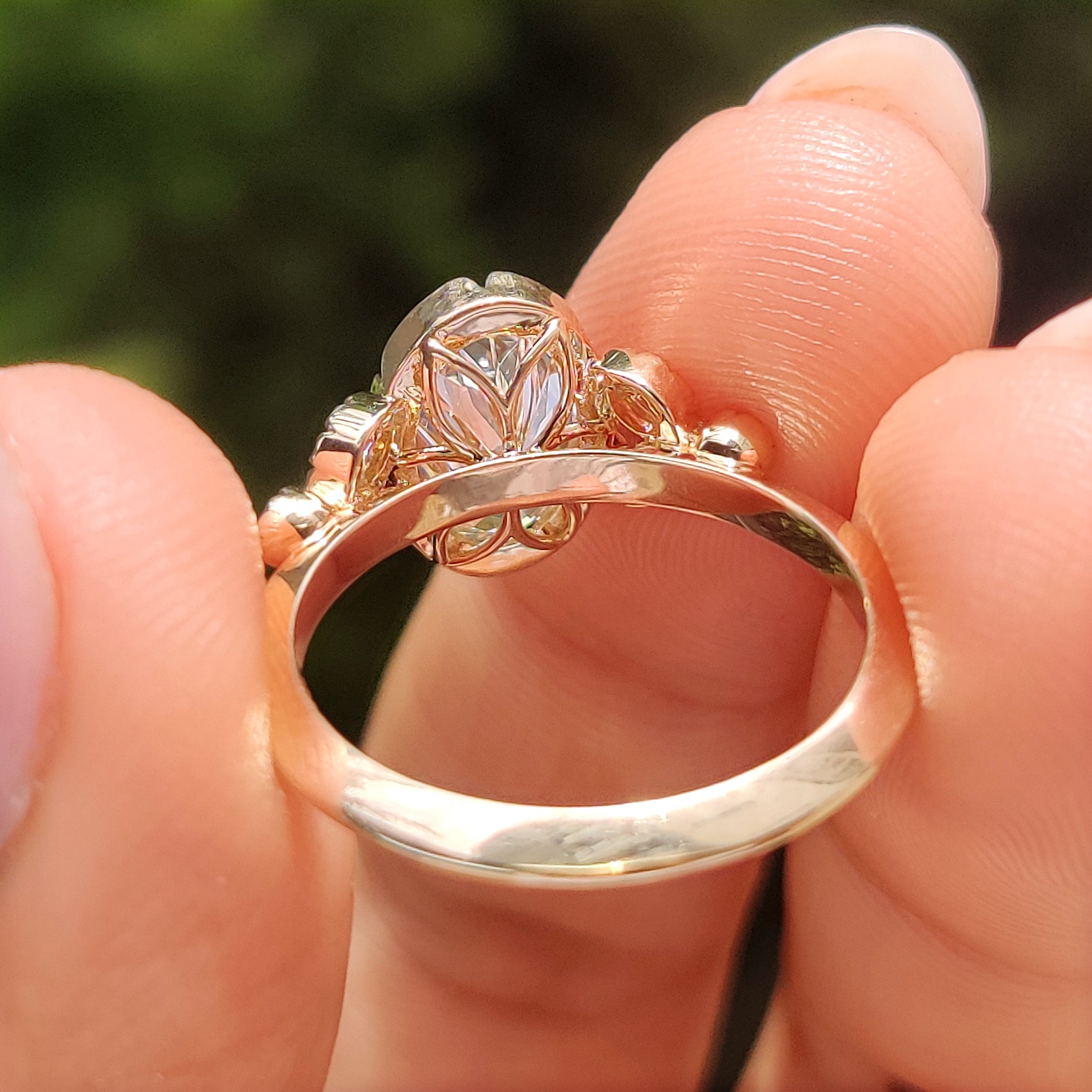 Oval center diamond in tulip setting

