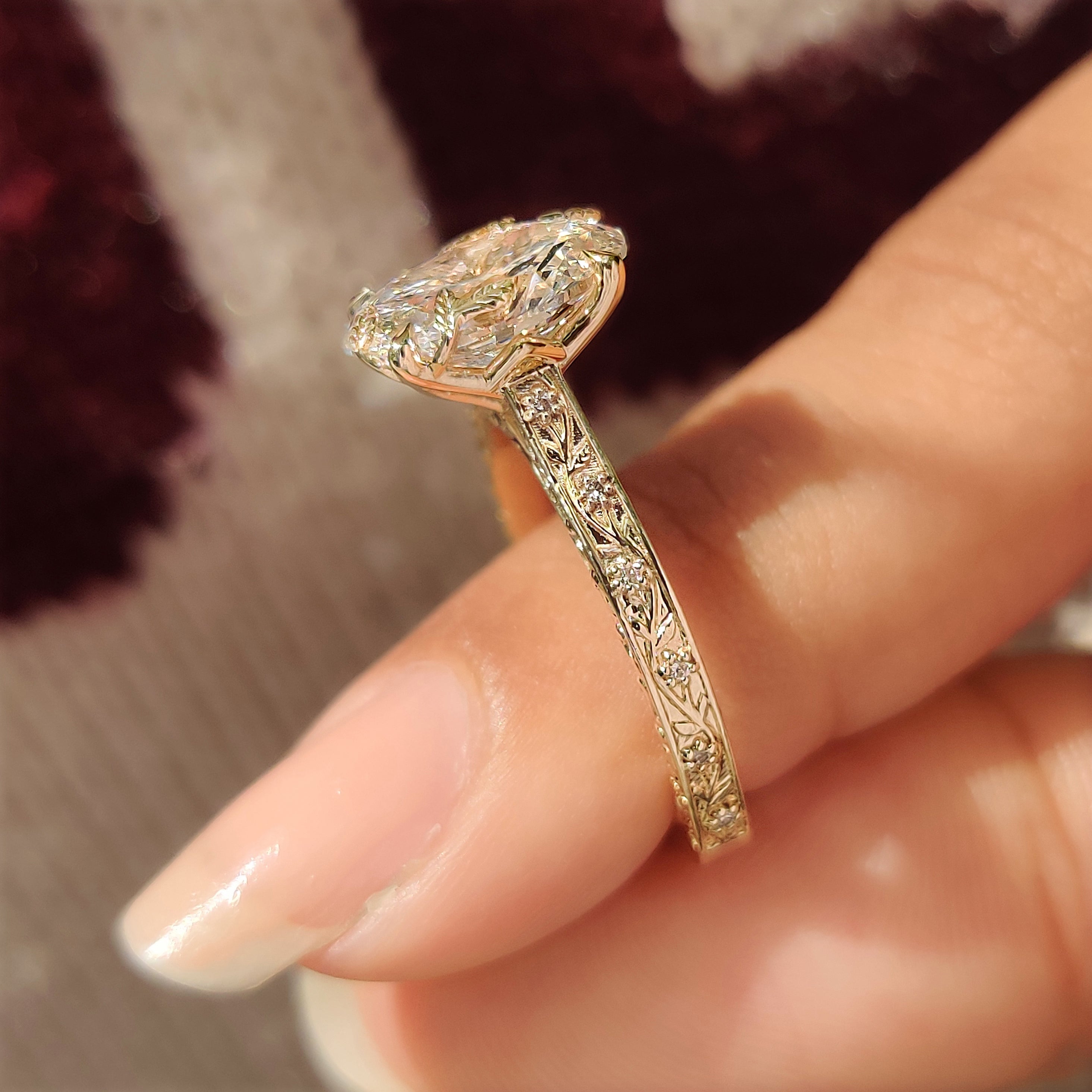 Handmade oval diamond ring with four claw prong setting
