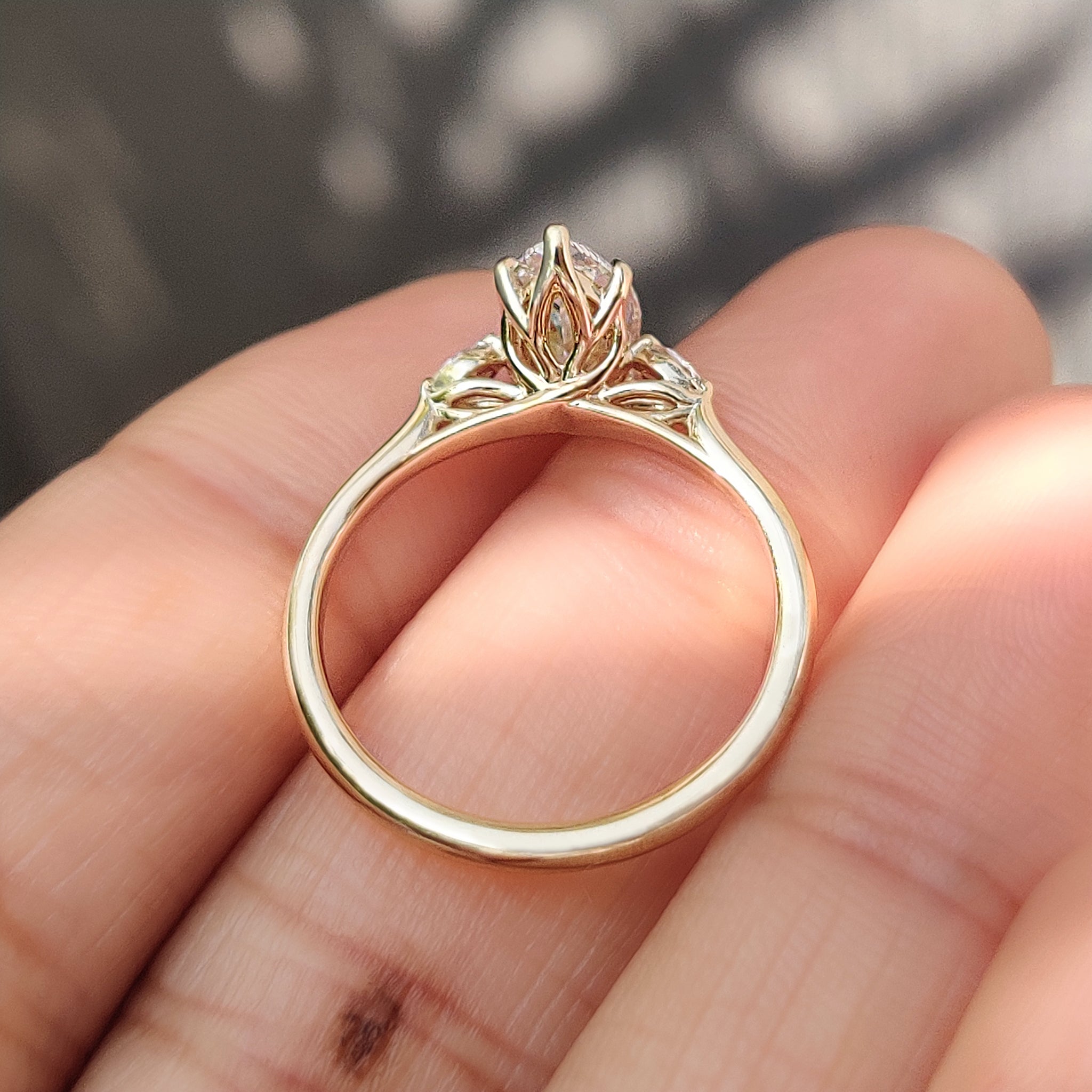 Handmade marquise ring by Carat Diamonds with side stones.
