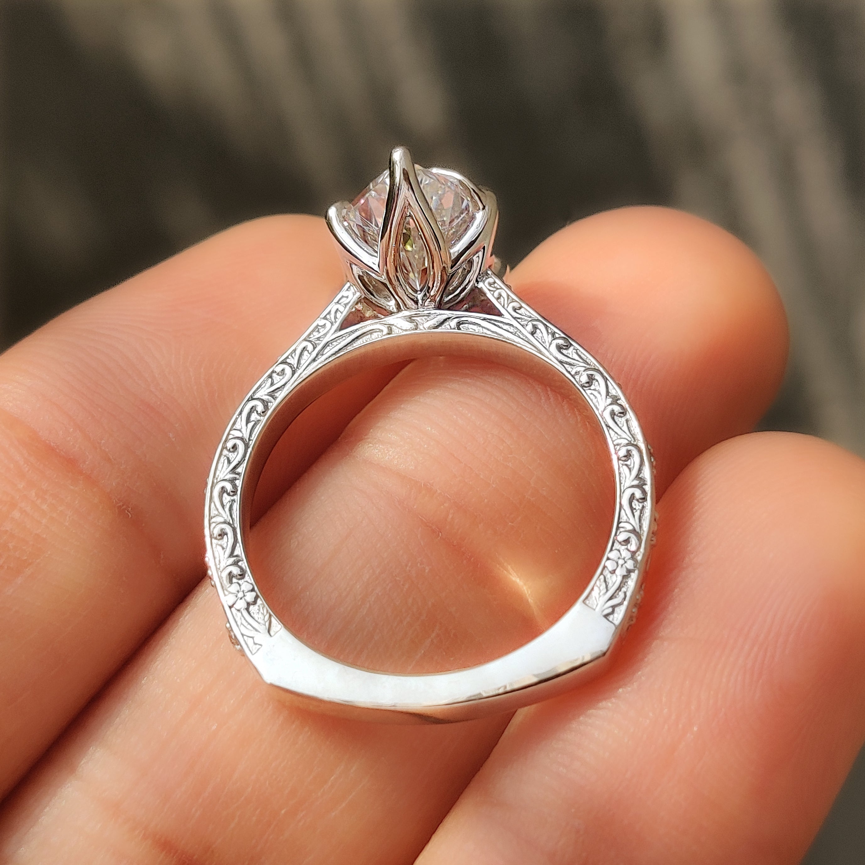 Tulip setting holding a Dutch marquise center stone.
