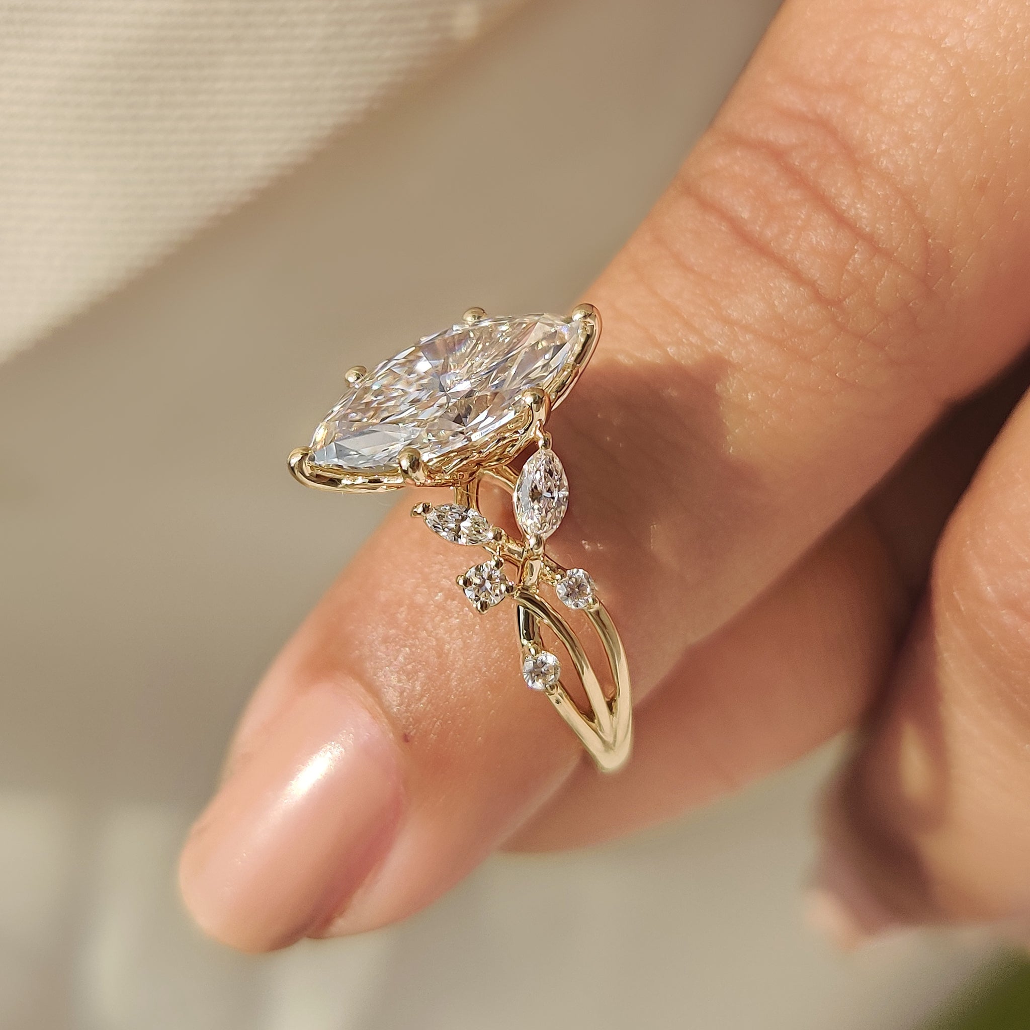 Handmade twisted shank marquise diamond engagement ring design.
