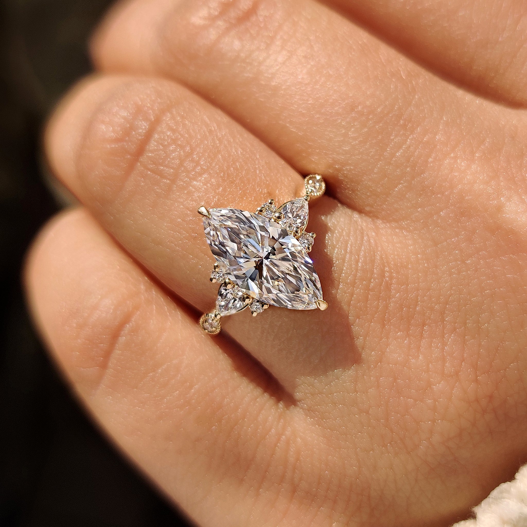 Marquise diamond ring with milgrain outline and muse setting.
