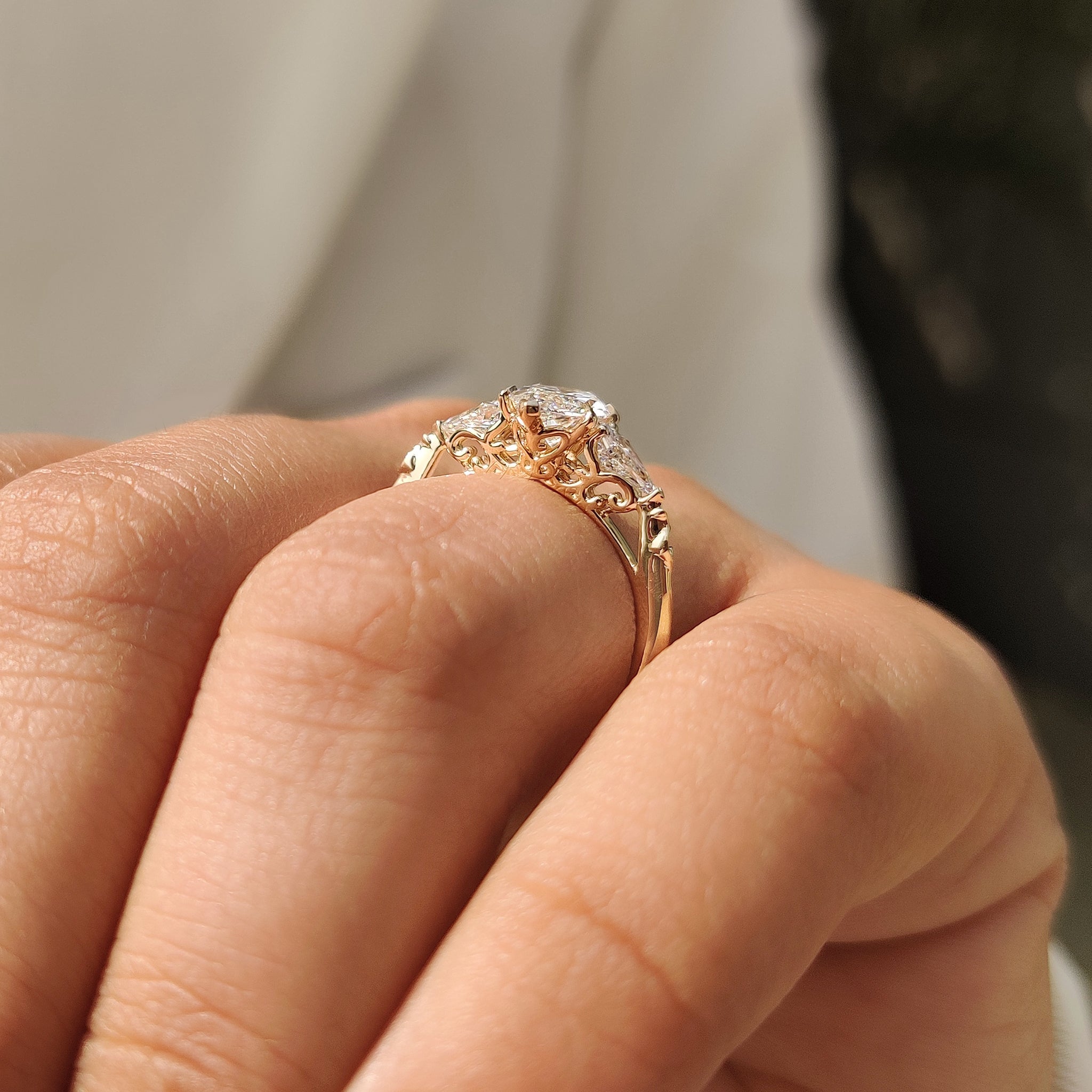 Marquise diamond ring with four claw prong and two V prong tips
