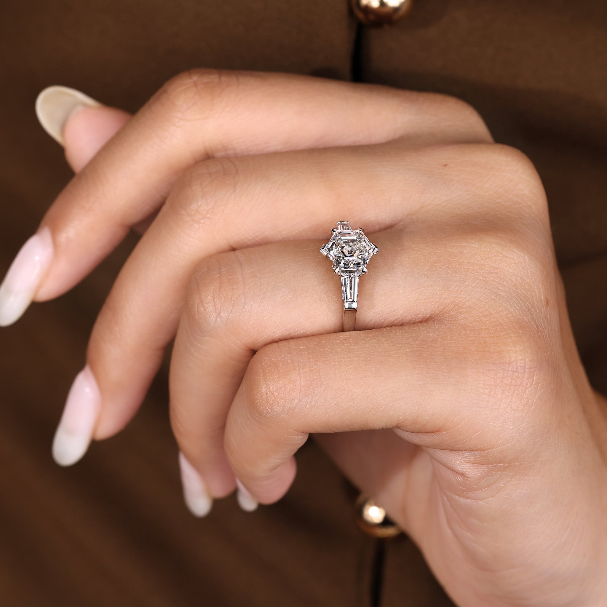 Handmade three diamond ring with hexagon center diamond.
