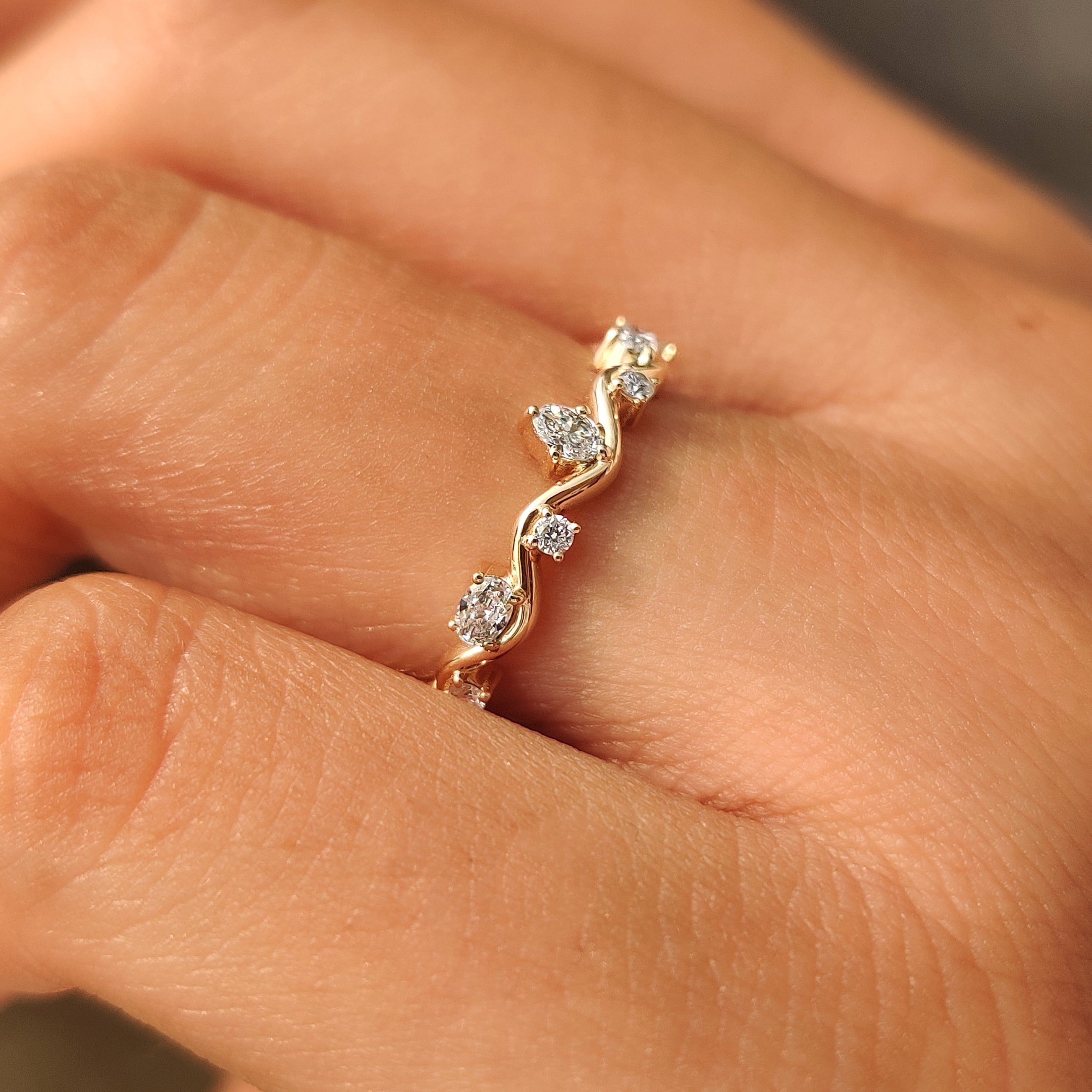 Yellow gold band with individually set diamonds.
