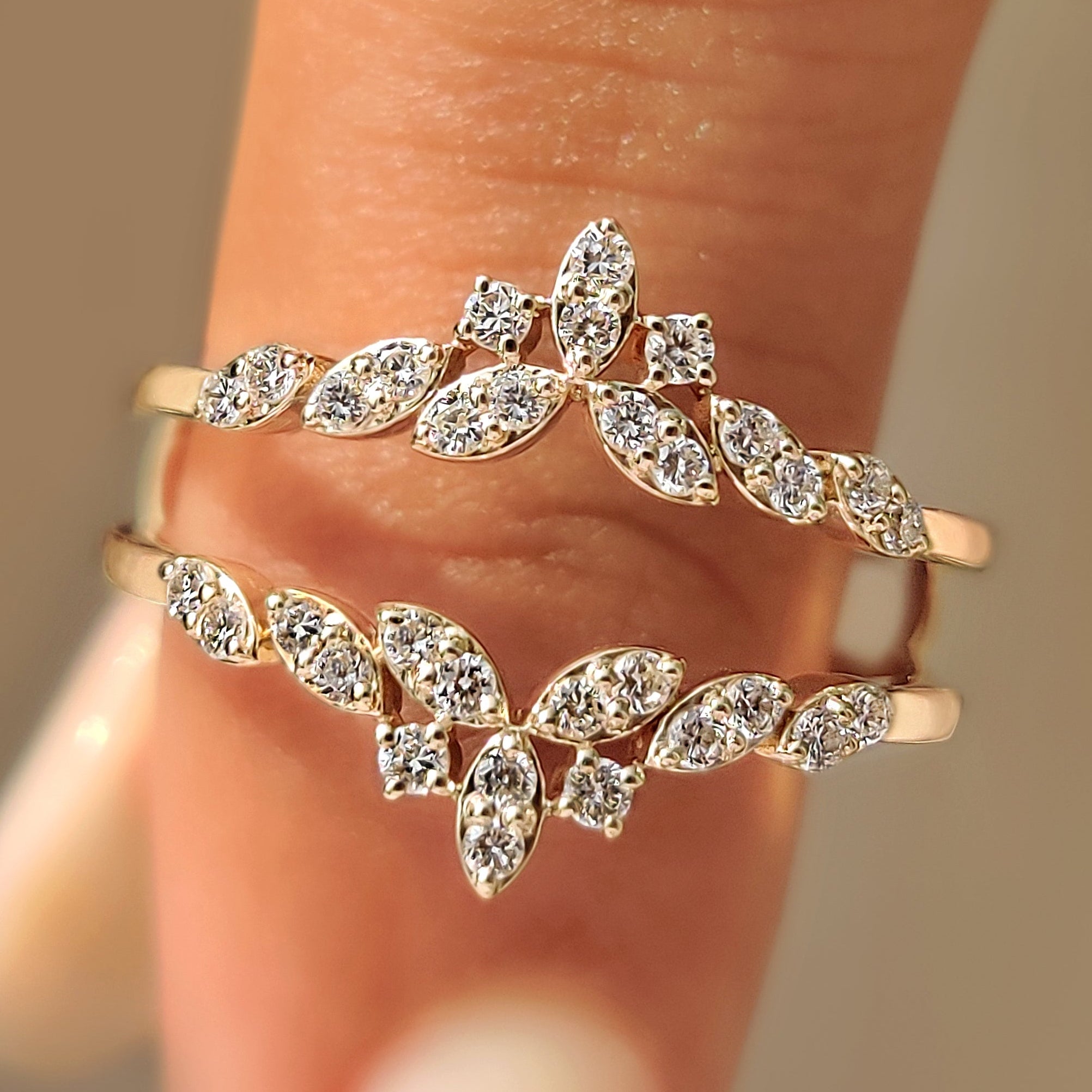 Round diamond wedding band with wrap guard design.