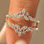 Round diamond wedding band with wrap guard design.
