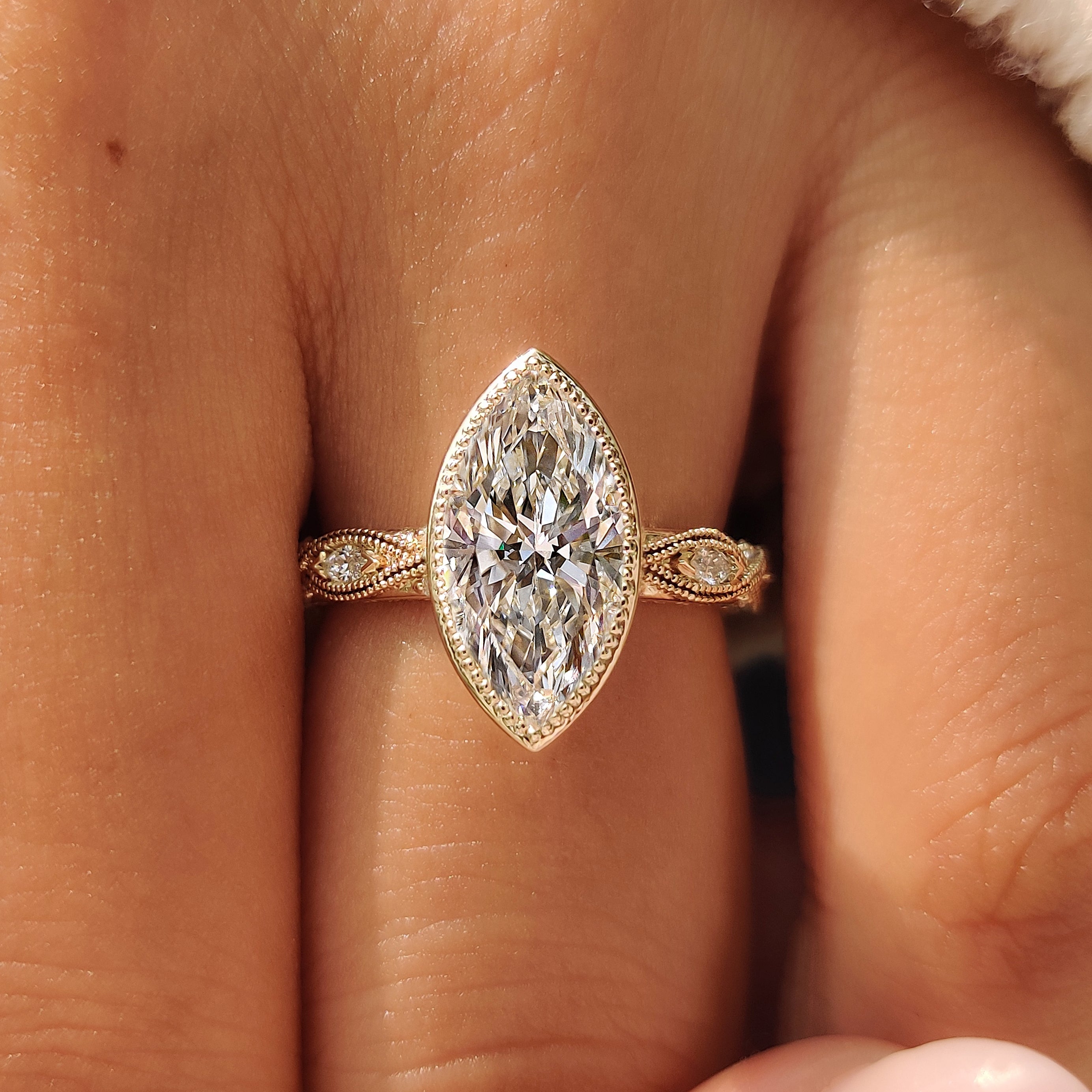 Round and marquise pave setting on a vintage inspired ring band.

