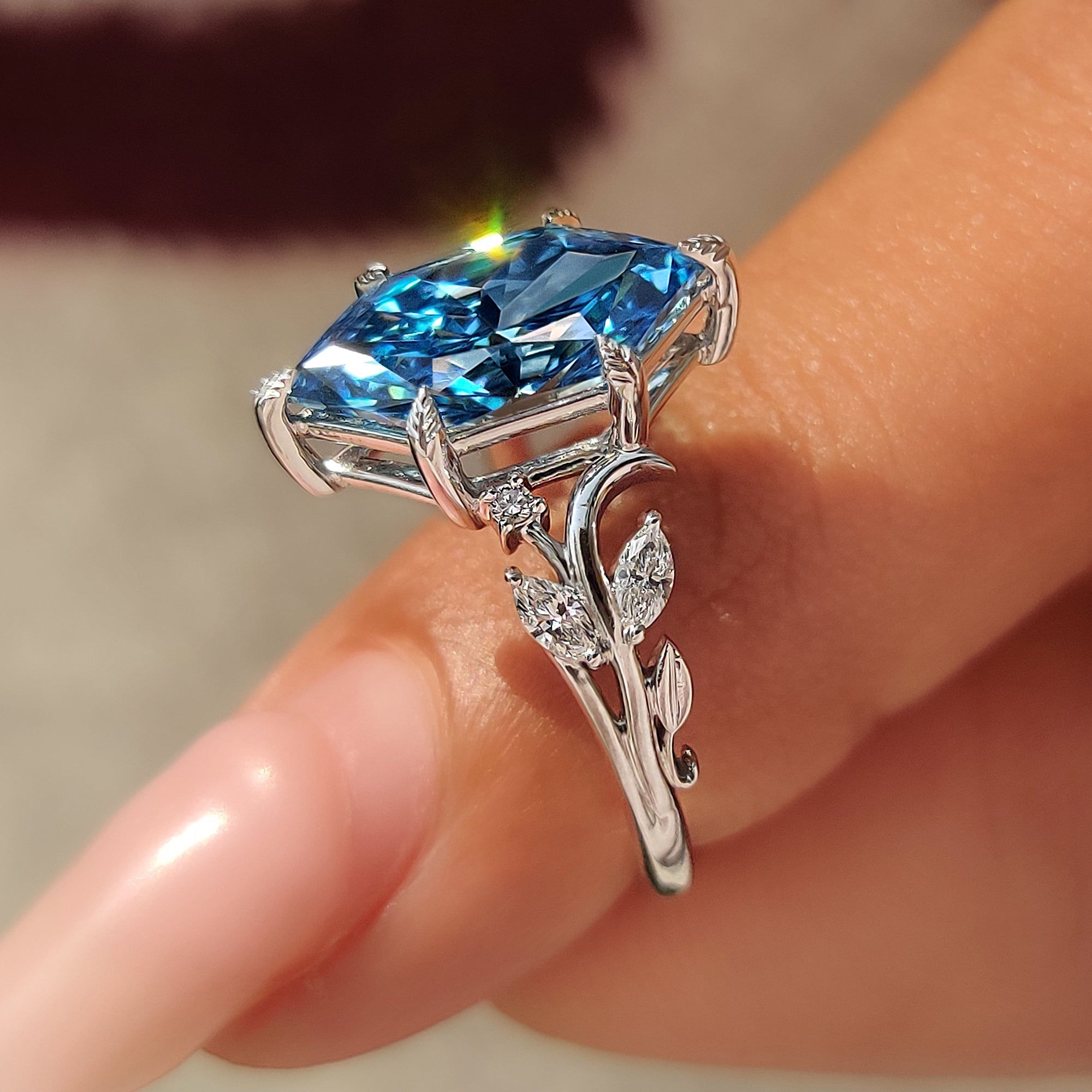 Leaf and vine design on nature inspired engagement ring.
