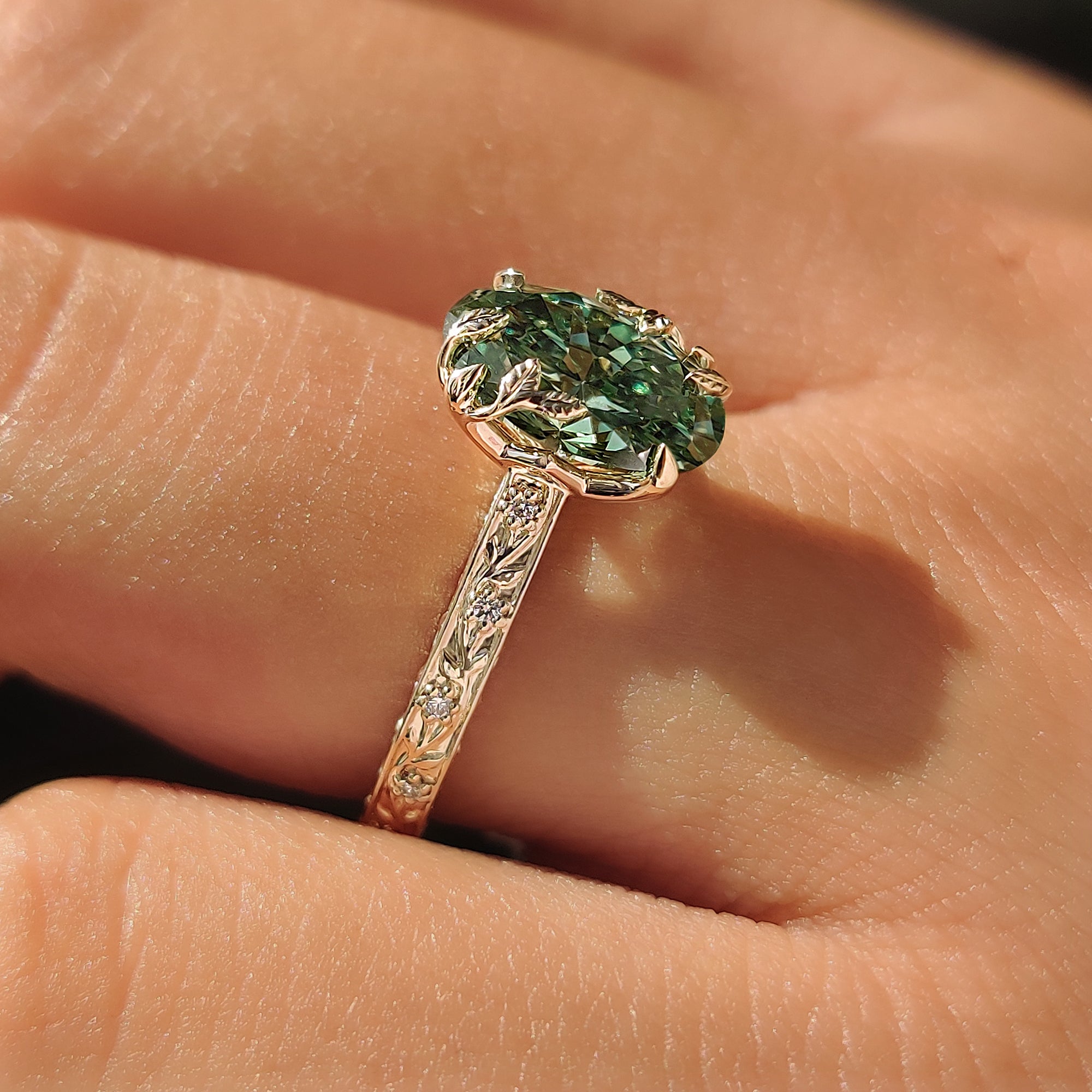 Tulip setting on a green oval diamond ring.
