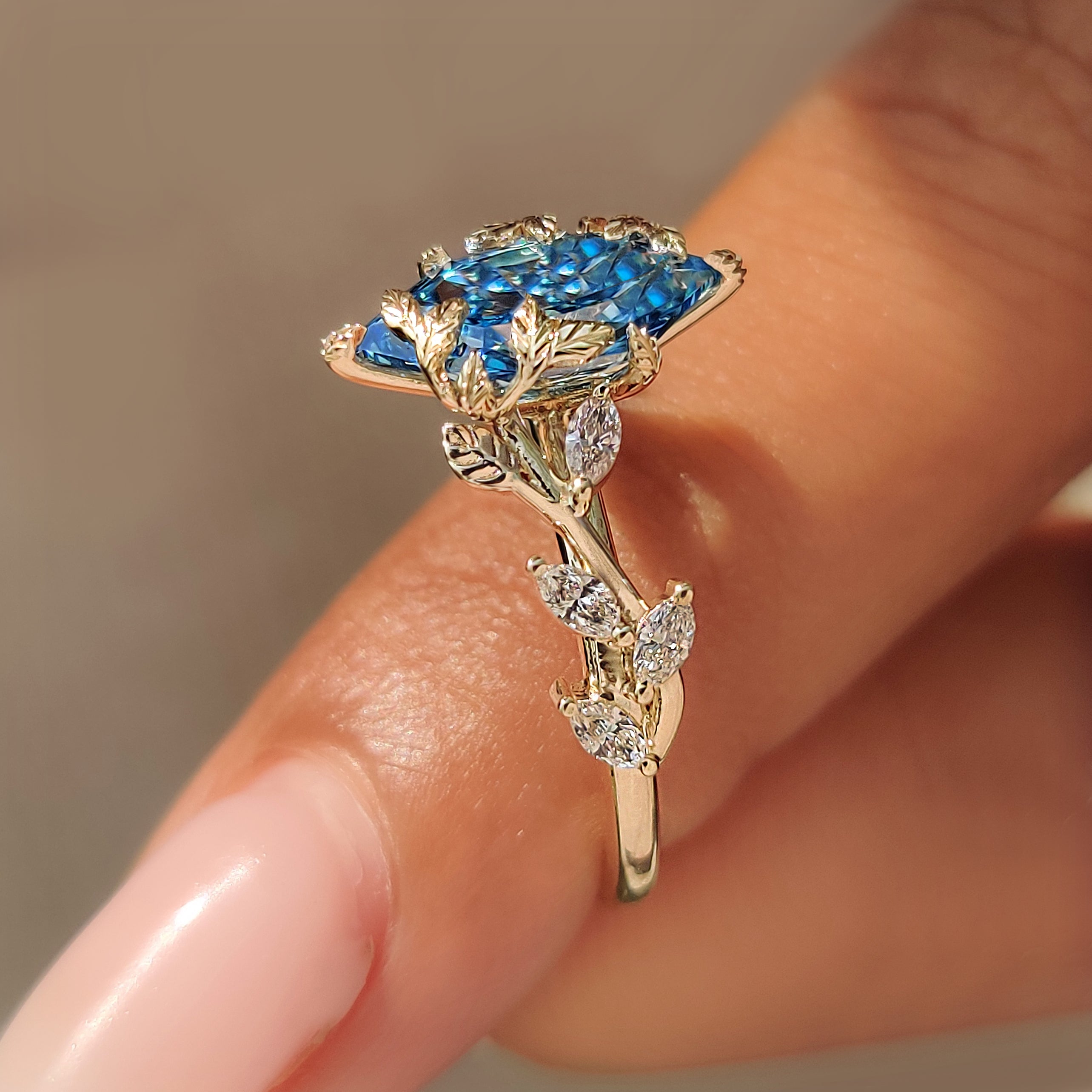 Blue Dutch marquise diamond set in a nature inspired ring.
