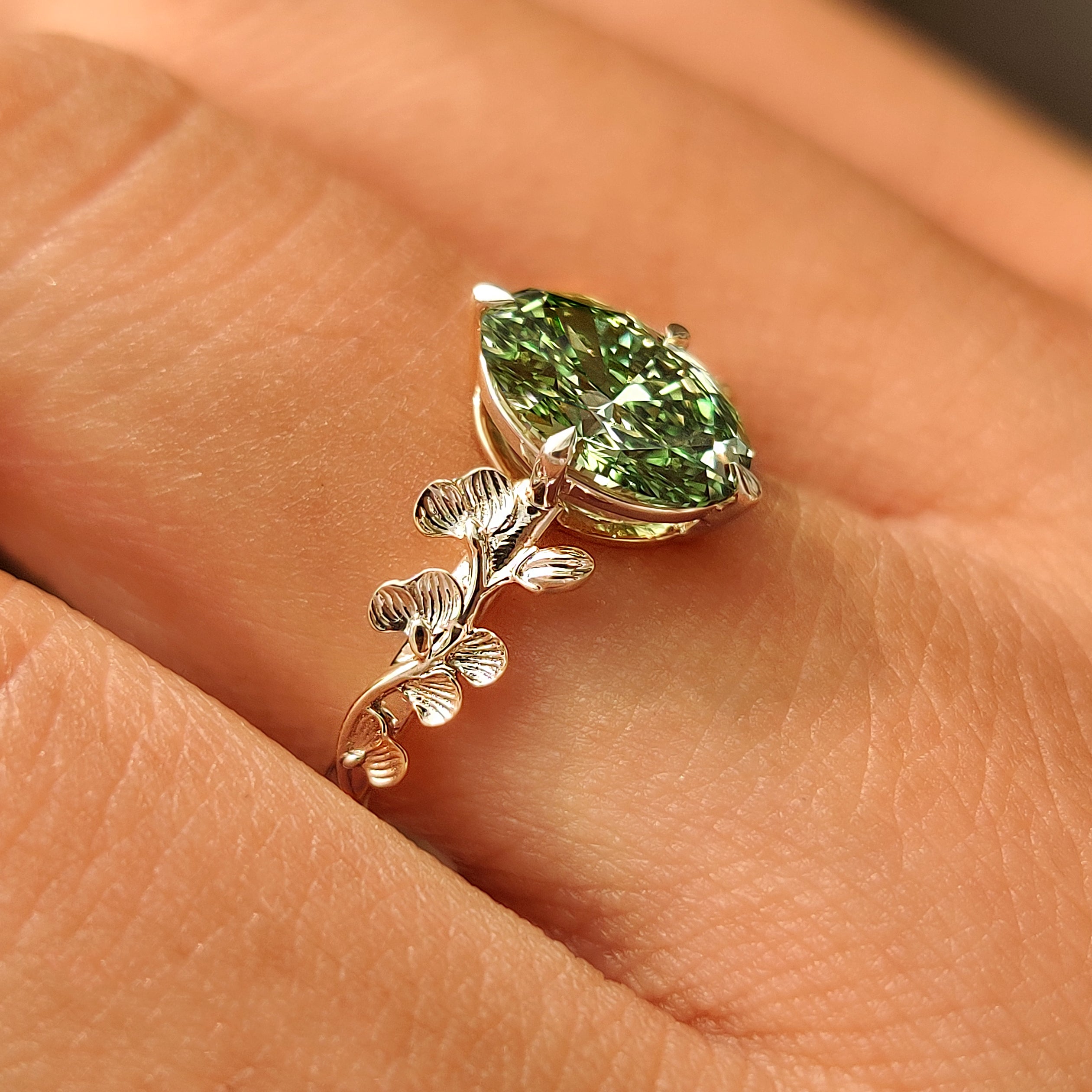 Nature inspired green oval diamond engagement ring.
