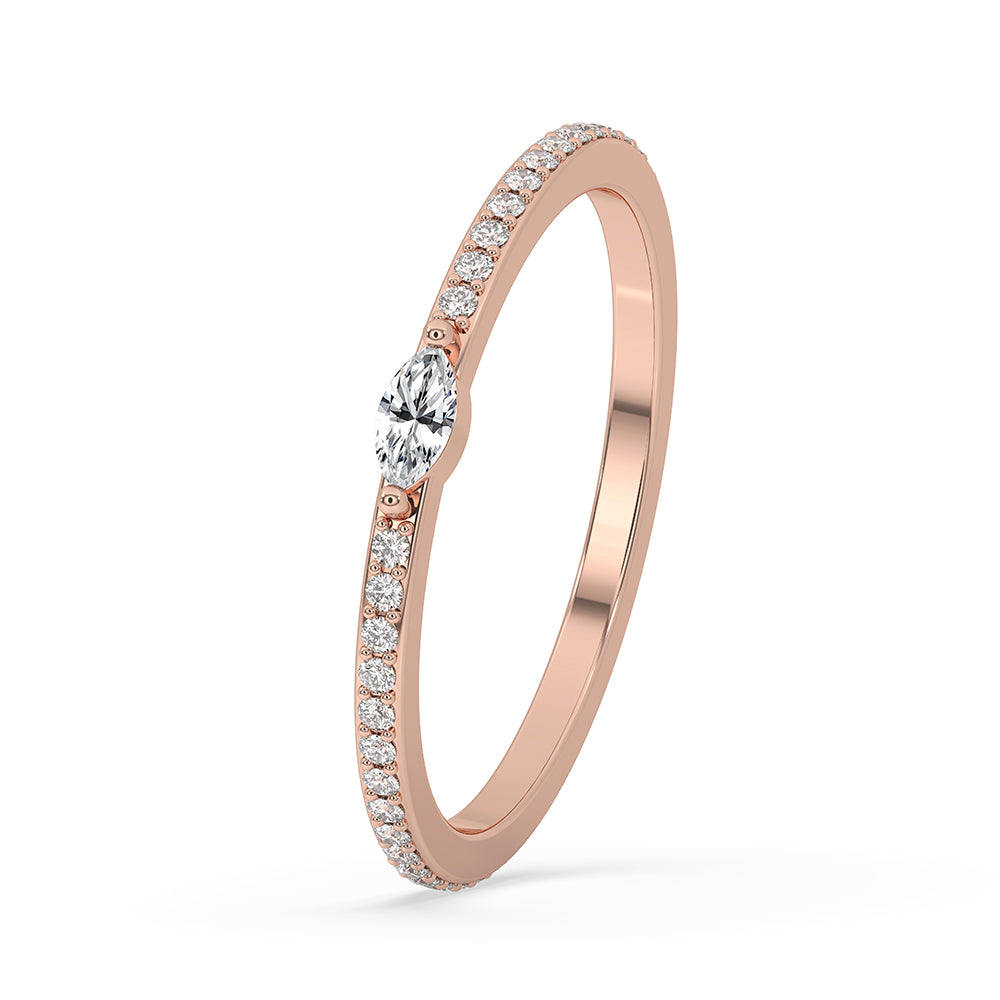 Rose gold wedding band with prong set diamonds.
