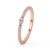 Rose gold wedding band with prong set diamonds.
