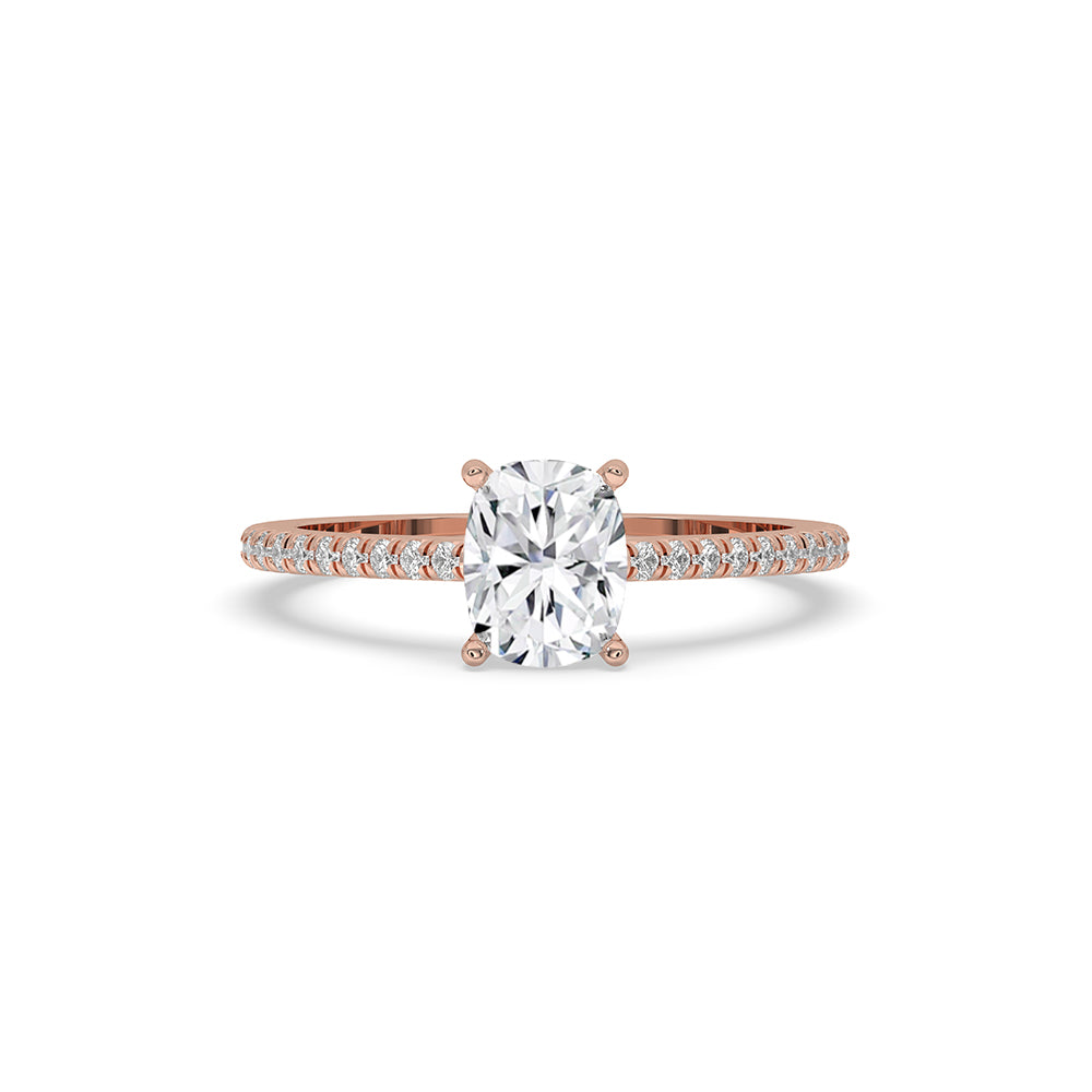 Pave engagement ring with cushion cut diamond, prong setting, and rose gold band.

