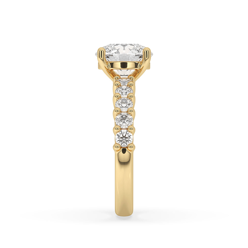 A yellow gold engagement ring shines with classic warmth.