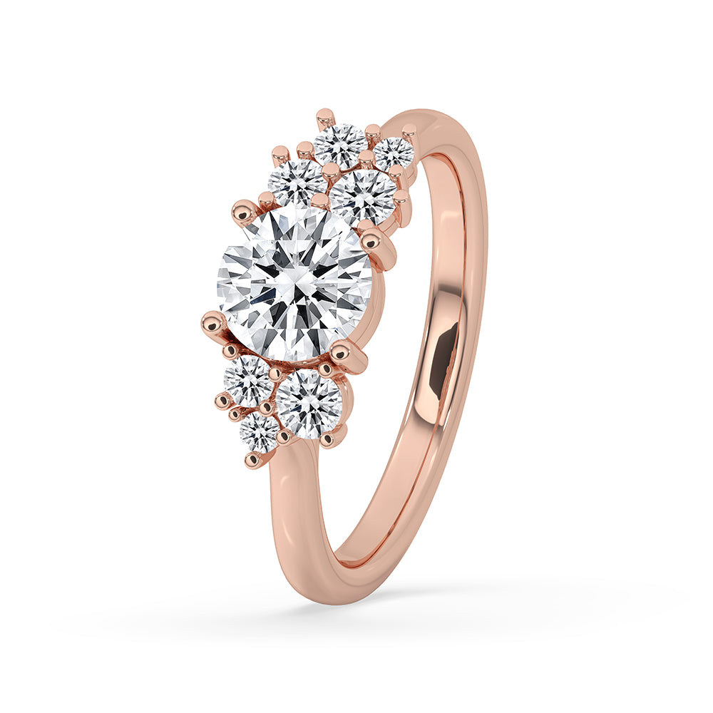 Round cut diamond ring in rose gold with a prong setting design.
