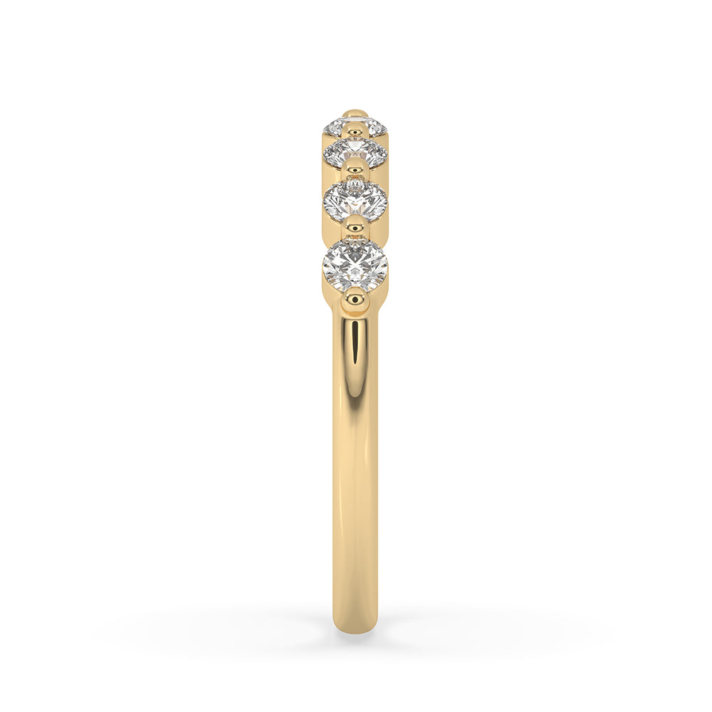 Round diamond eternity band set in a stunning yellow gold band.