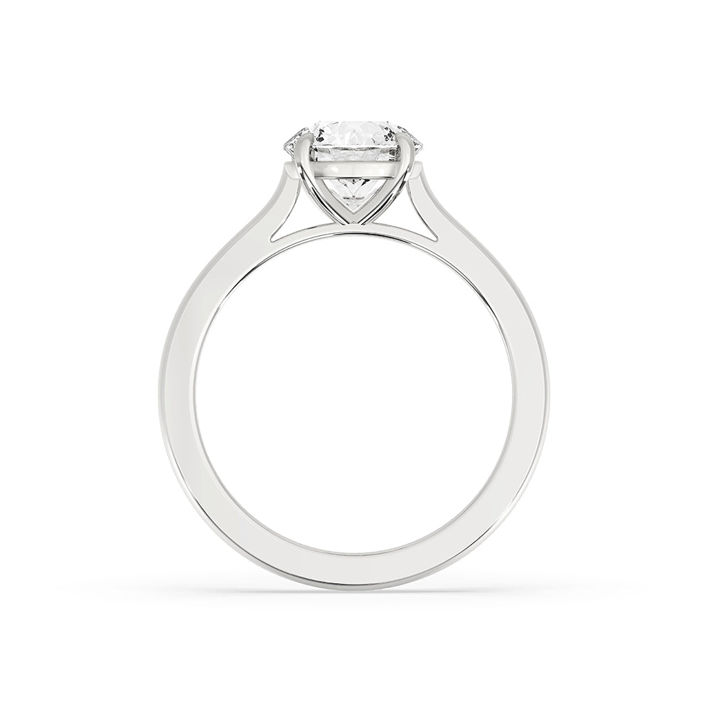 Handcrafted white gold solitaire diamond ring with a round cut diamond.
