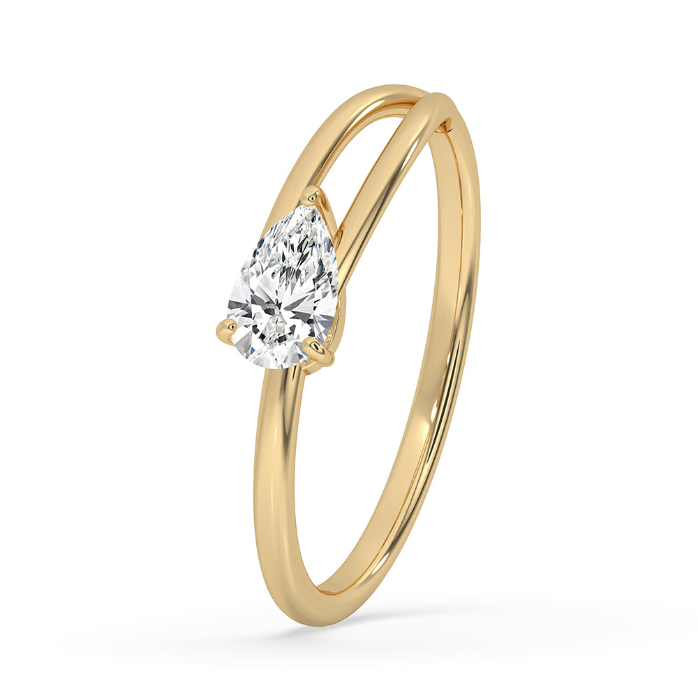 Pear cut diamond ring in a yellow gold band for a custom engagement ring.
