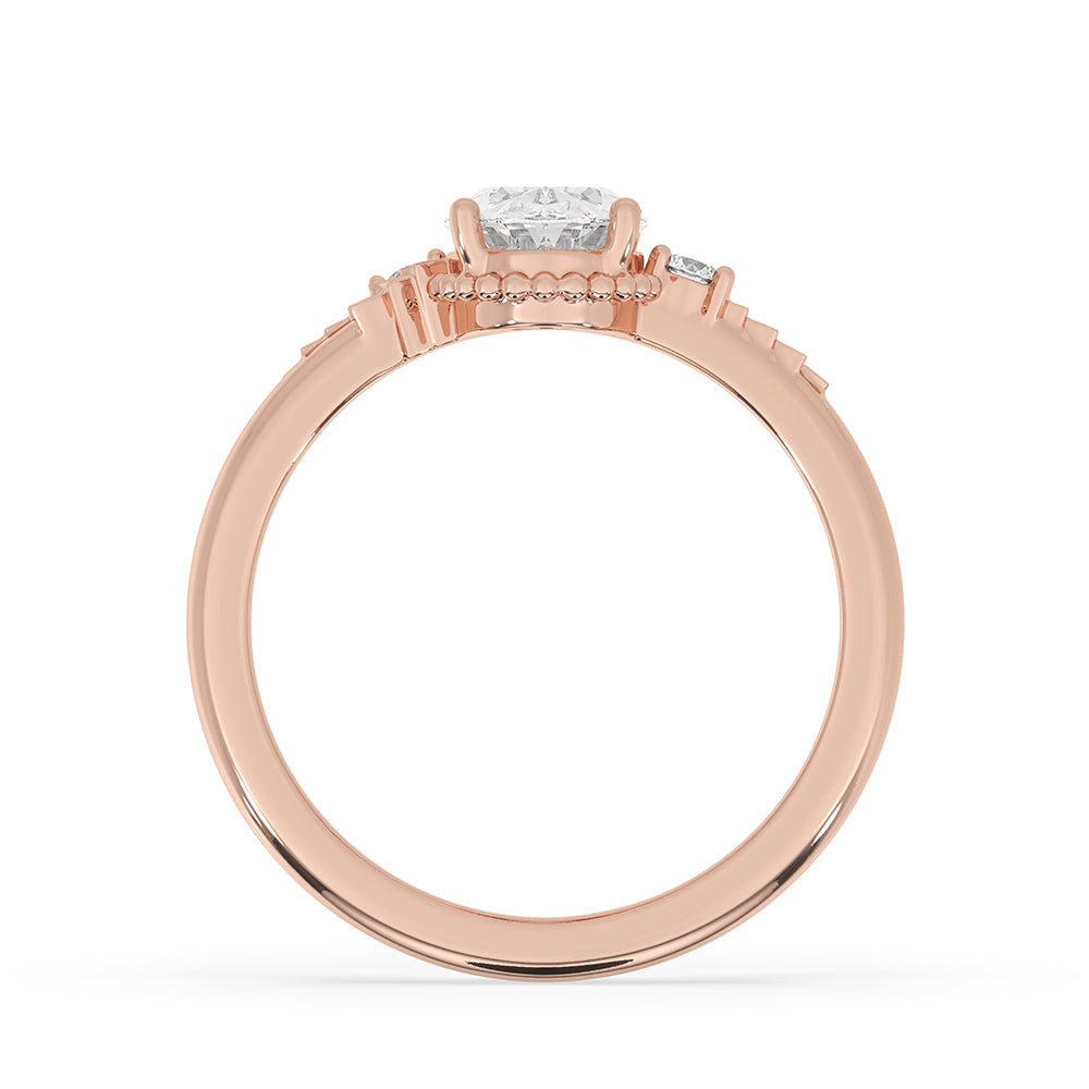 Carat Diamonds ring featuring a round side stone design.

