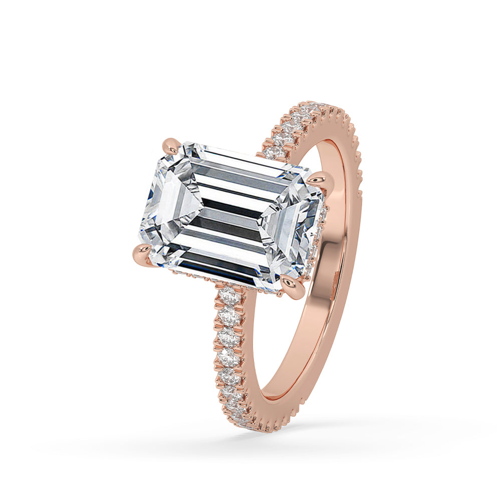 Hidden halo ring with round diamonds in rose gold.
