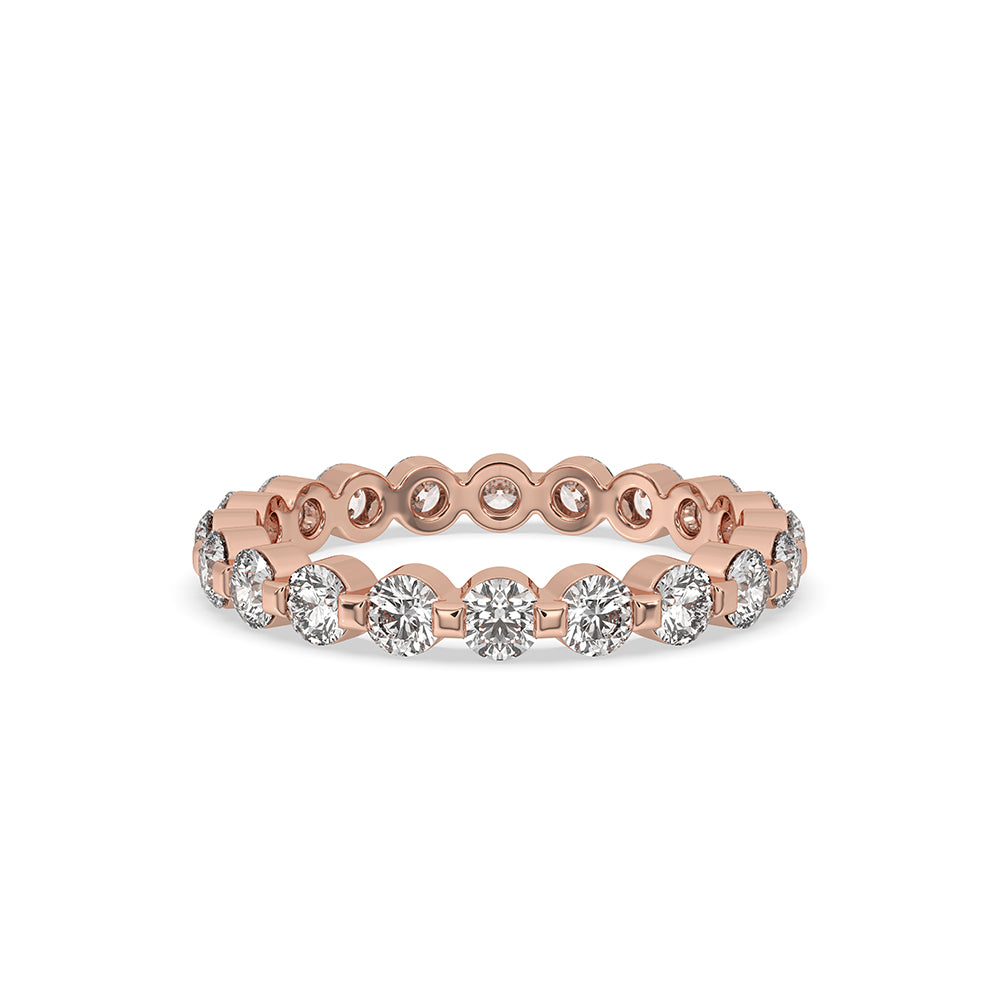 Rose gold eternity band featuring lab grown diamond accents for a timeless look.
