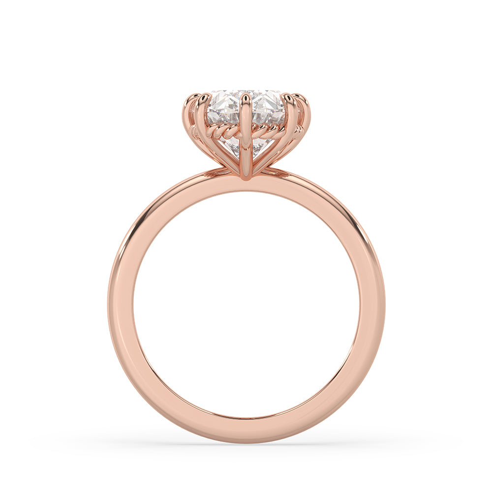 Engagement ring with 8 claw prongs holding the diamond.
