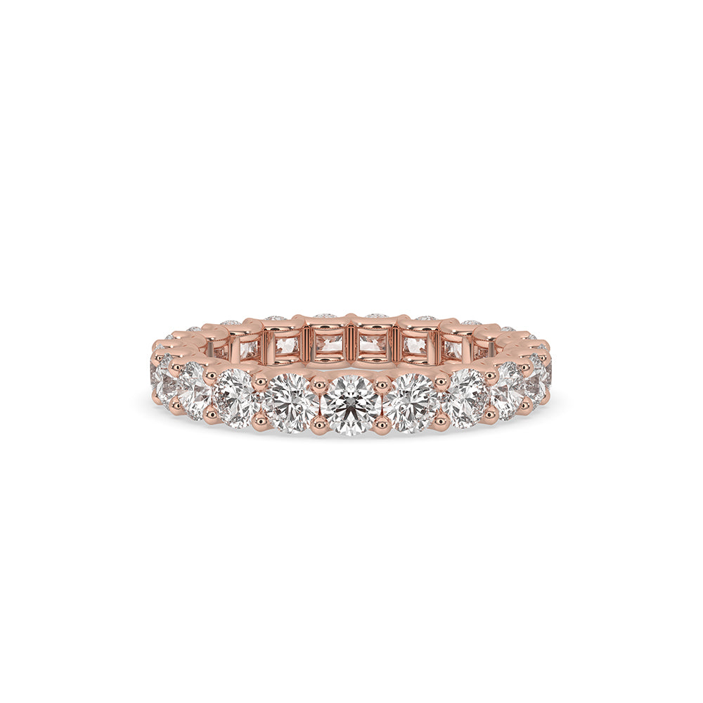 Rose gold engagement band with a round diamond wedding band design.
