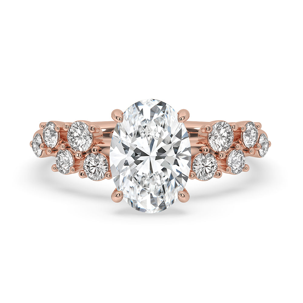 Oval cut diamond ring in a unique design with a four claw prong setting.
